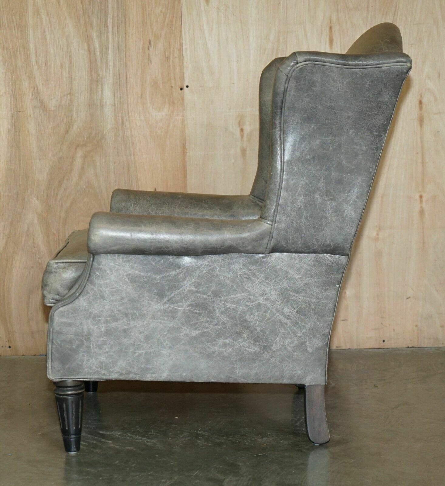 photo vinterior Luxury Pair Of Contemporary Grey Blue Leather Wingback Armchairs Ebonised Legs