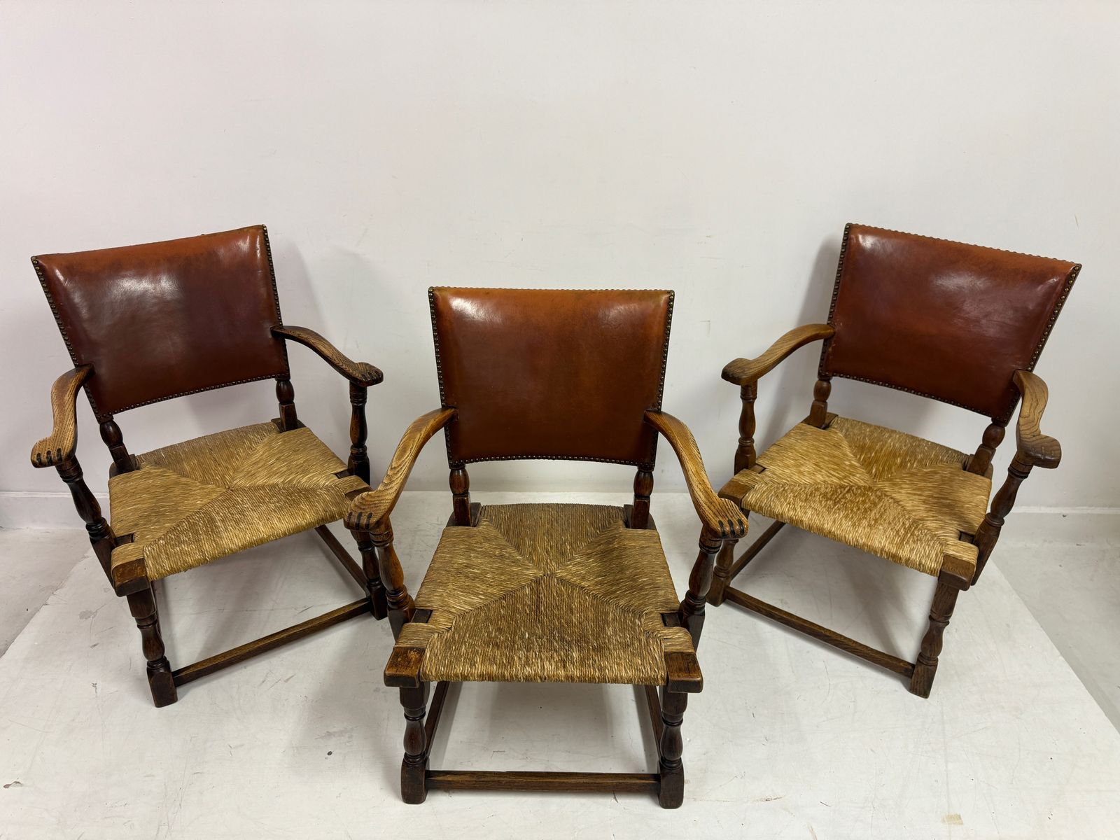 photo vinterior Set Of Three Oak Armchairs With Rush And Leather Seats
