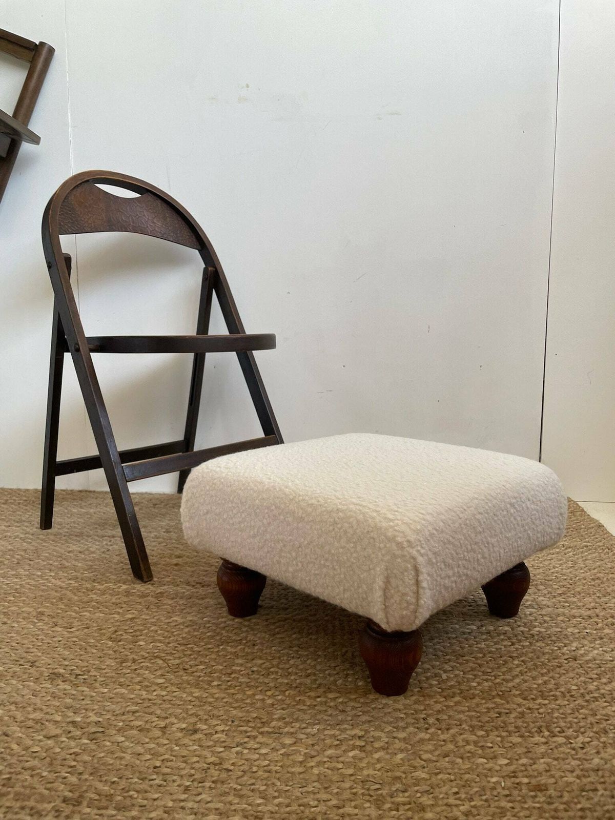 Chunky Low Lying Footstool With Tapered Legs And Cream Boucle Fabric