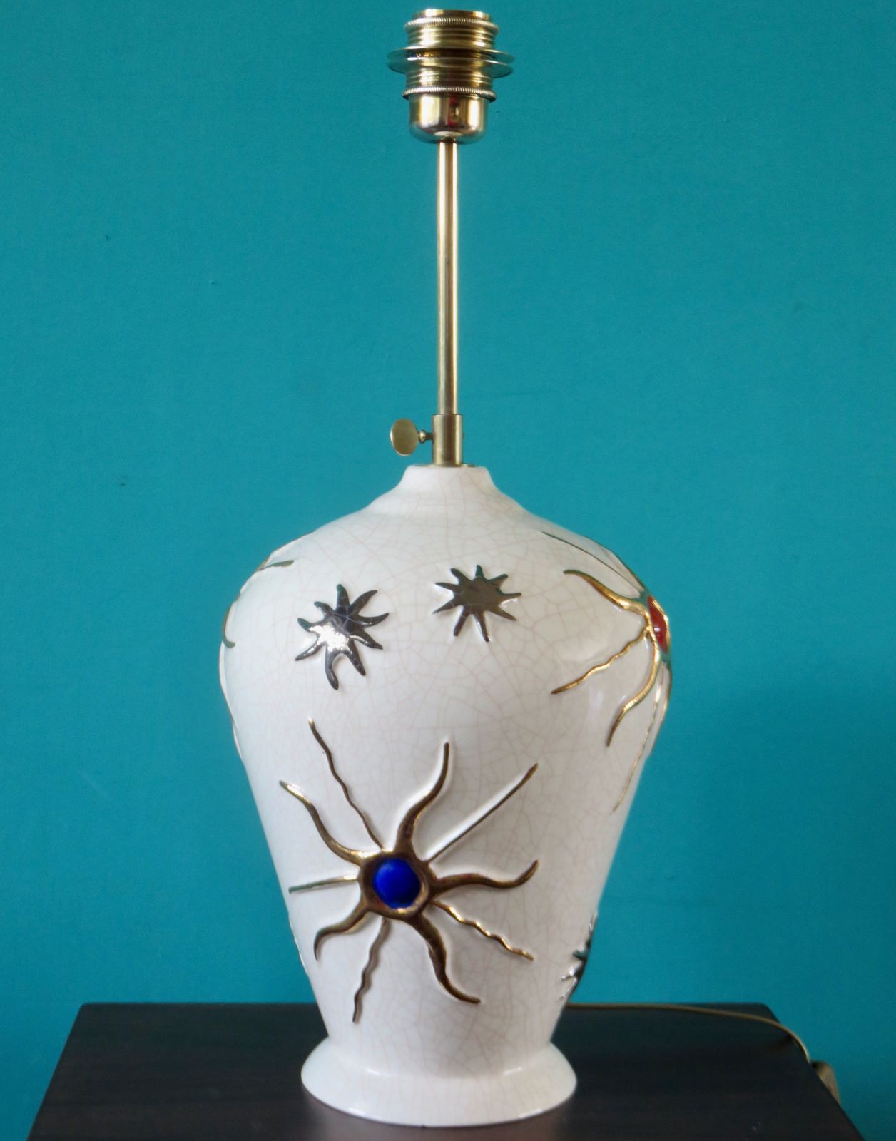 Large Ecru Cracked "Longwy" Earthenware Lamp With Bas Relief Of Suns And Stars. France 1945 1950 photo furniture