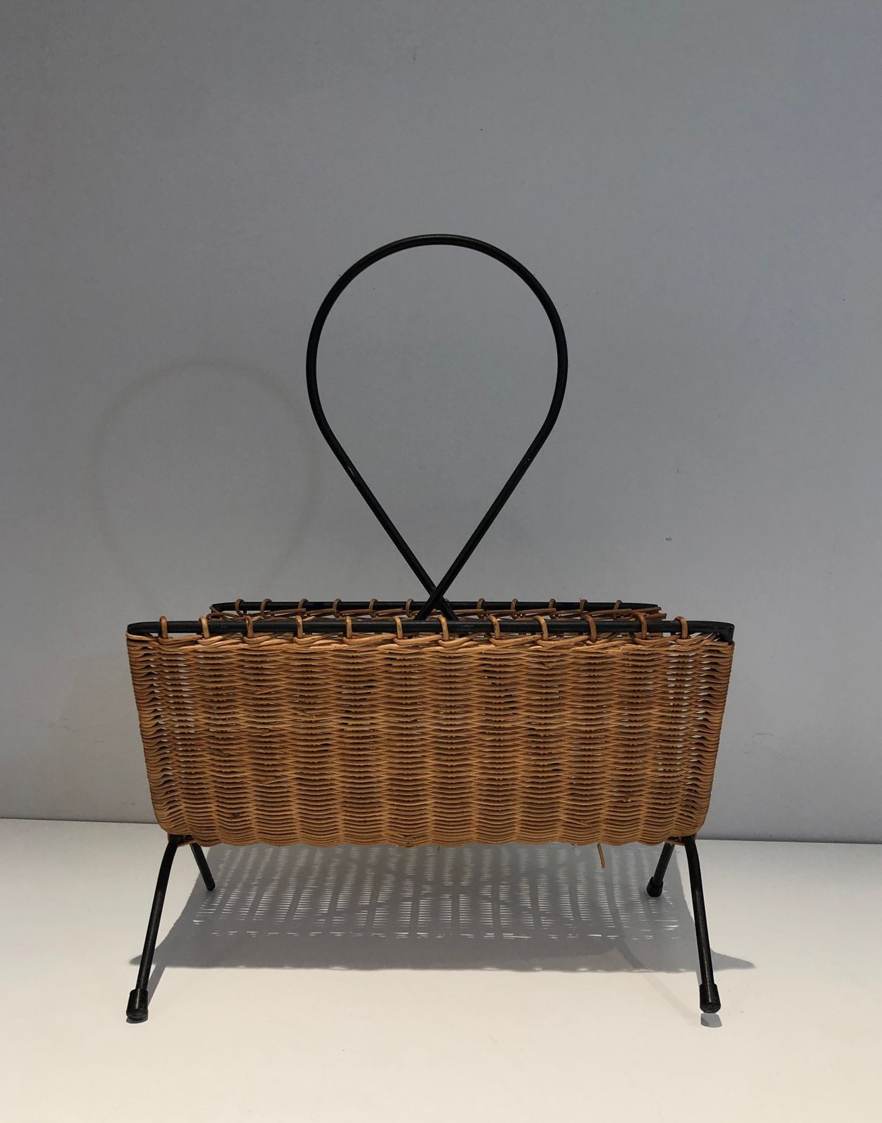 Rattan And Black Lacquered Metal Magazine Rack photo for sale