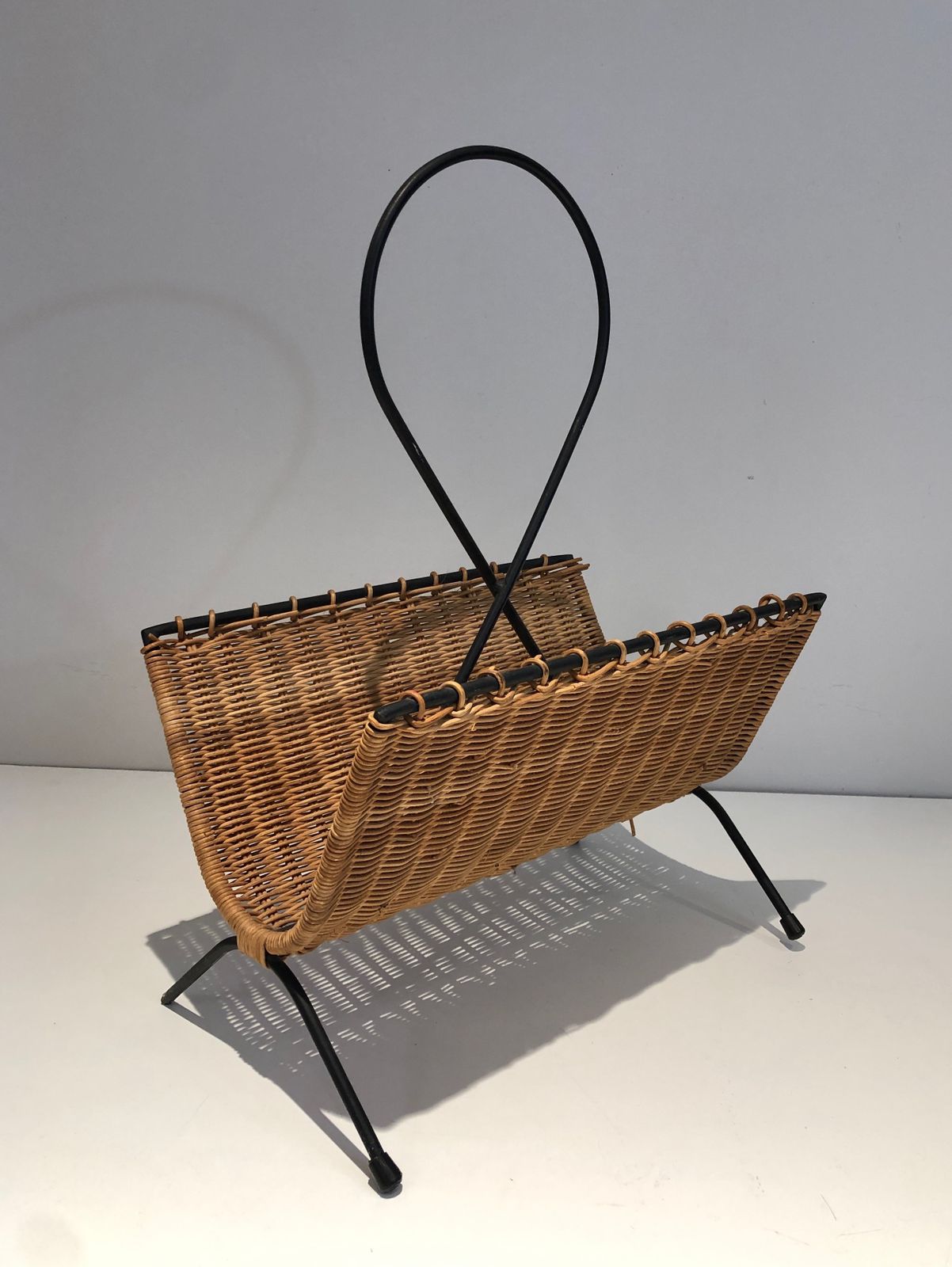 photo furniture Rattan And Black Lacquered Metal Magazine Rack