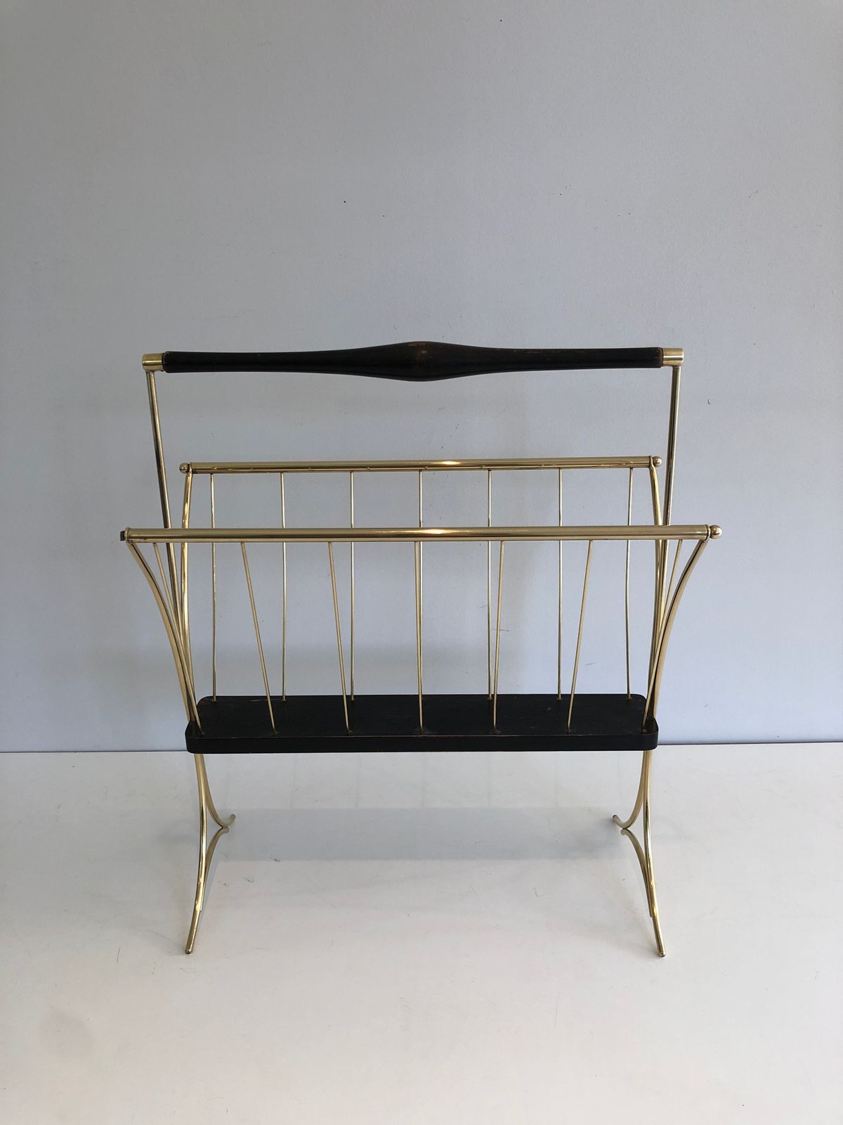 580.0 Magazine Rack In Blackened Wood And Brass photo