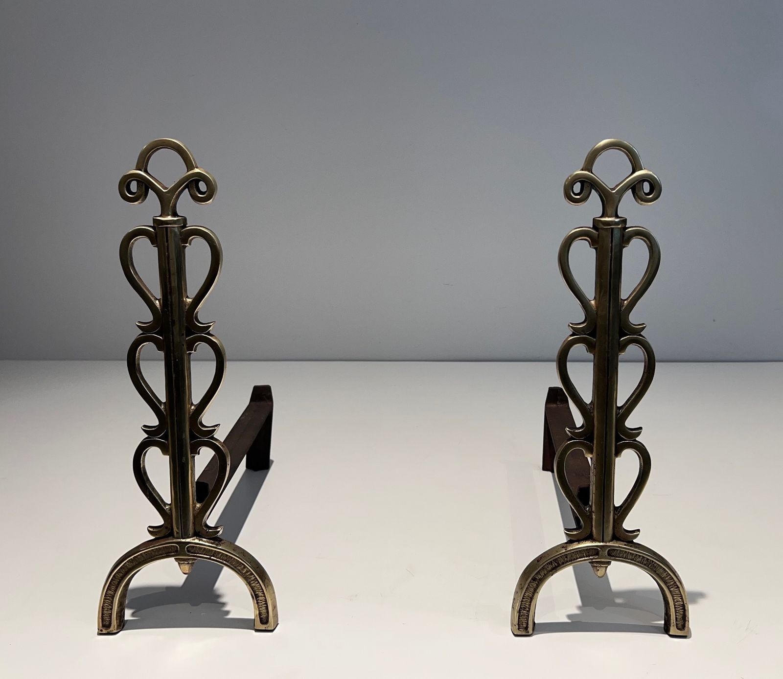 Pair Of Andirons In Brass And Wrought Iron In The Style Of Raymond Subes
