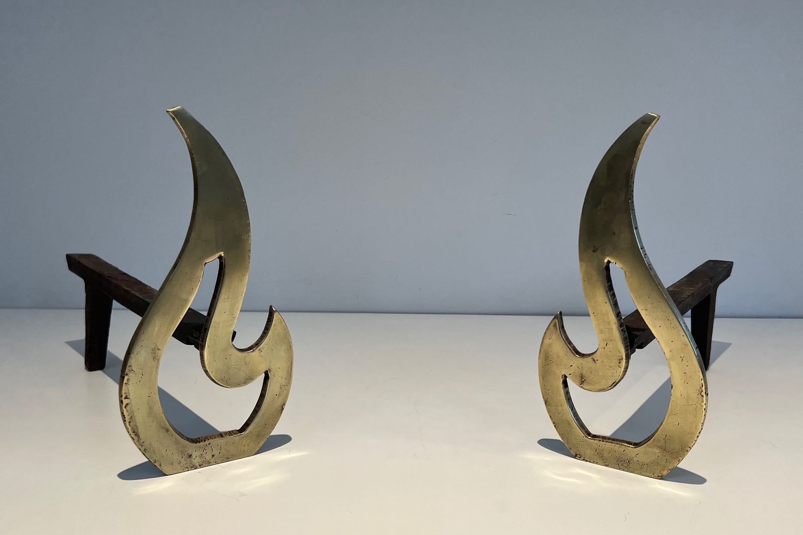 Pair Of Flame Andirons In Brass photo for sale