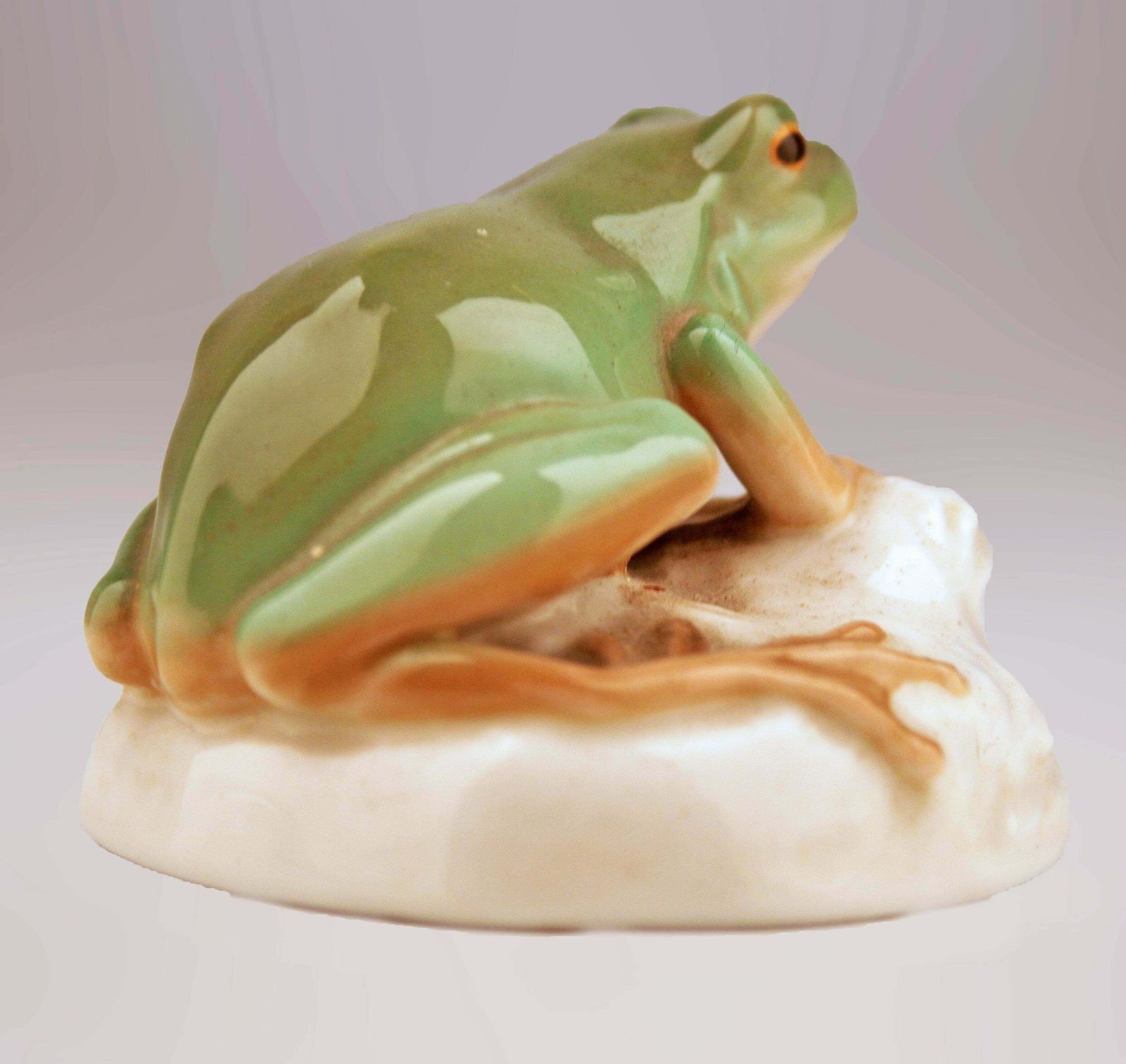 Mid 20th Century Modern German Glazed And Painted Porcelain Frog Sitting On A Rock By Manufacturer Nymphenburg photo for sale