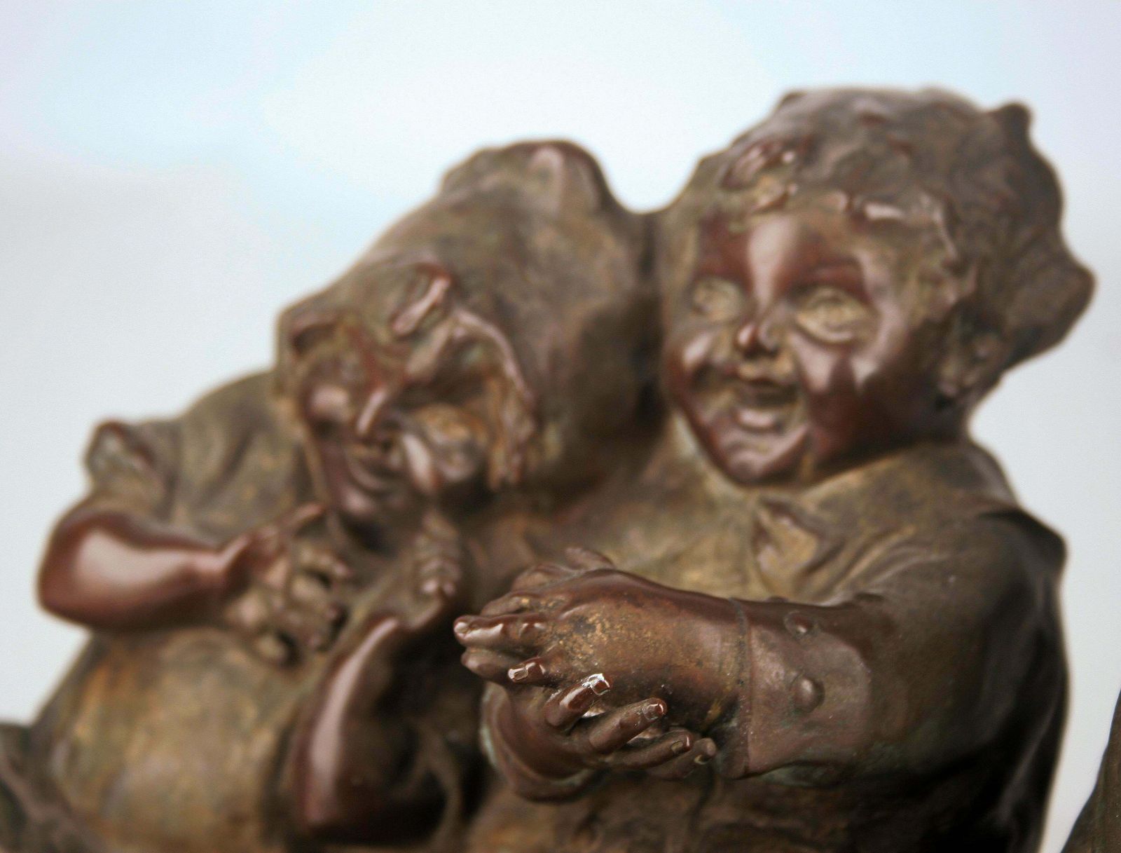 'Watching Something': Patinated Bronze Sculpture Of Three Children Laughing And Sitting By Spanish Artist Juan Clara photo buy