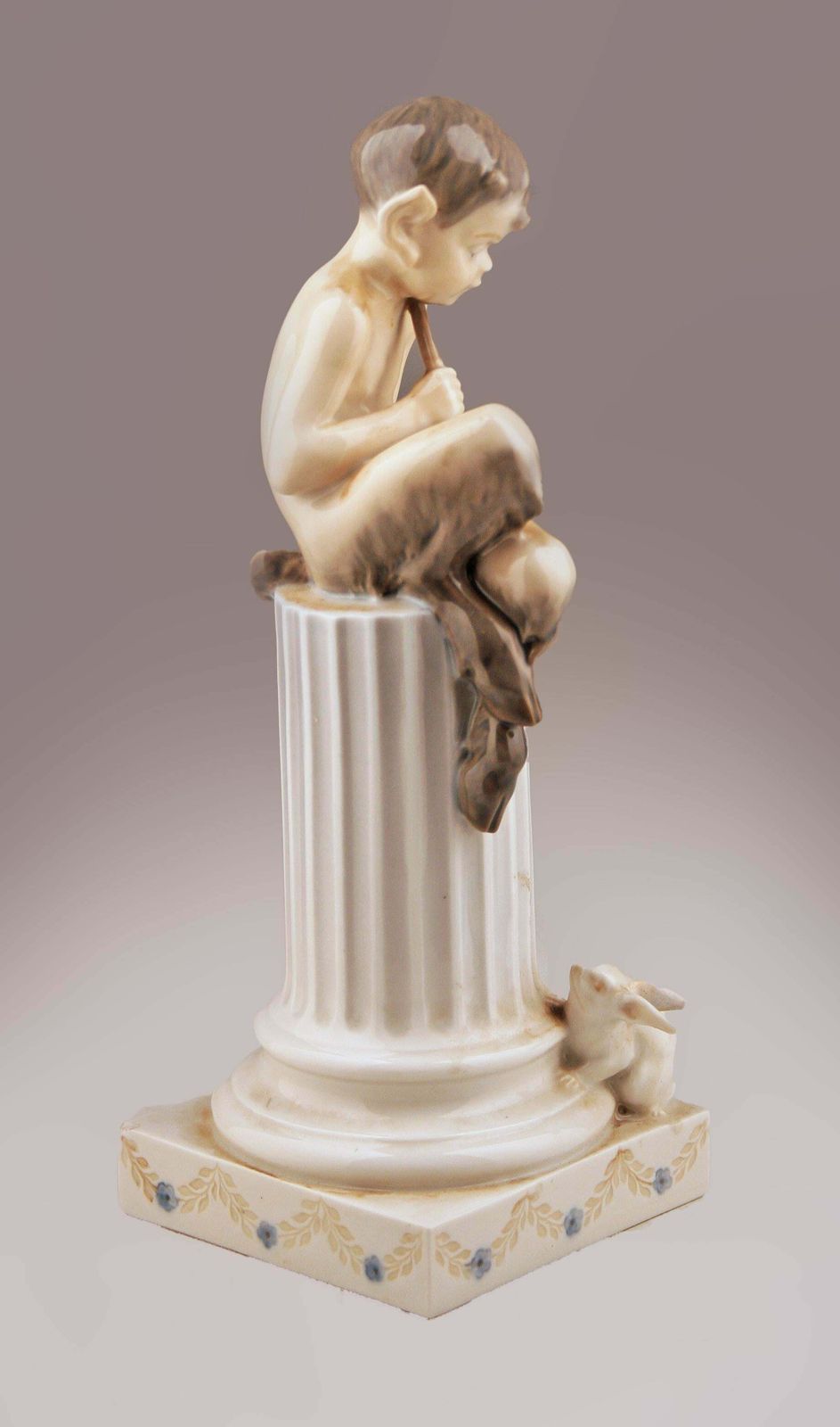Mid 20th Century Danish Glazed Porcelain Sculpture Of Faun (Satyr) Sitting Over A Column And A Rabbit By Danish Firm Royal Copenhagen photo for sale