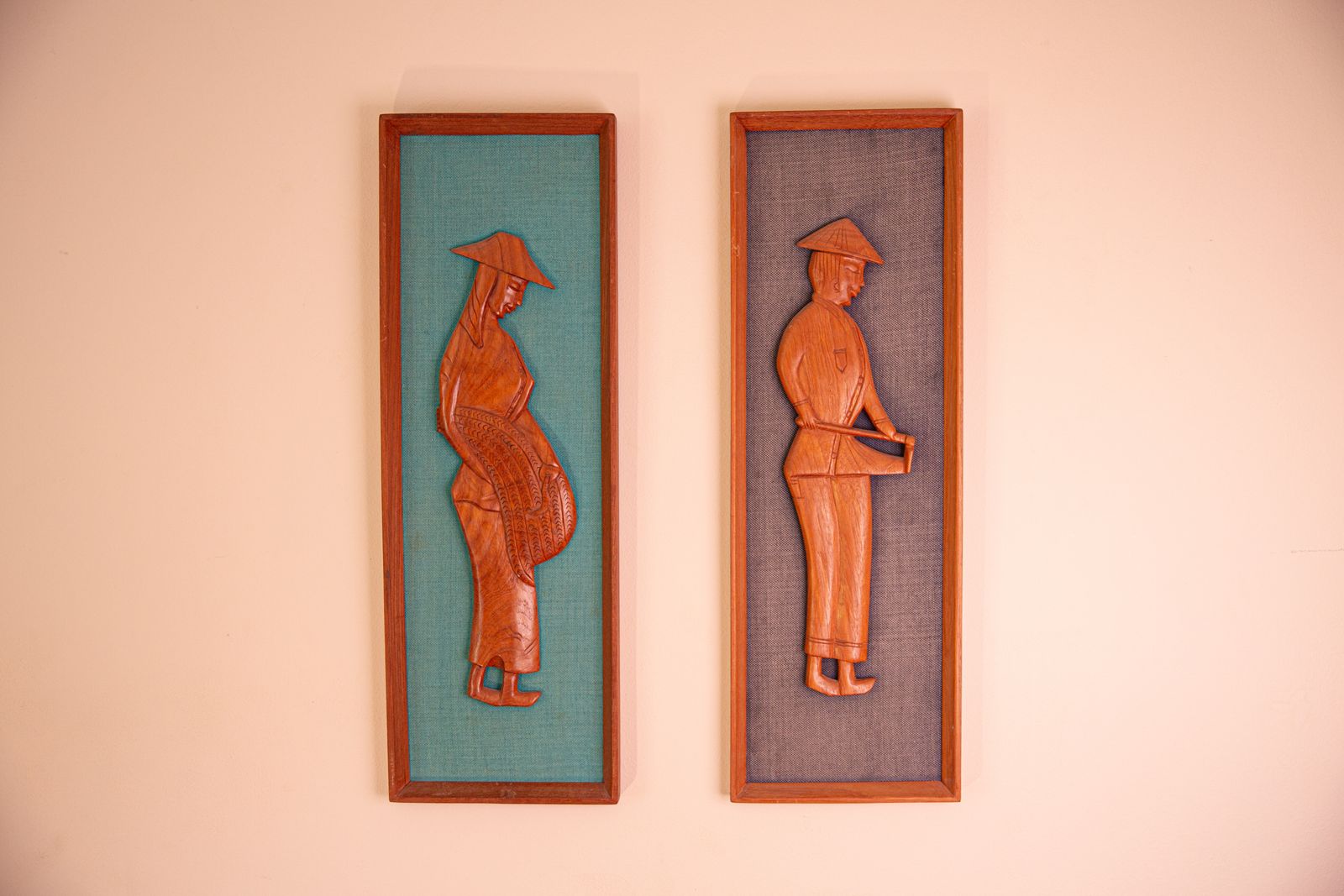Pair Of Mid Century South East Asian Hardwood Wall Sculptures On Blue Canvas In Teak Frames photo Art