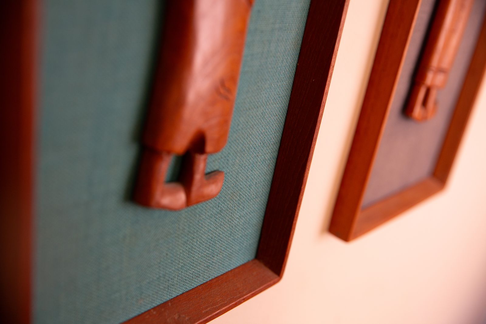 Pair Of Mid Century South East Asian Hardwood Wall Sculptures On Blue Canvas In Teak Frames photo buy