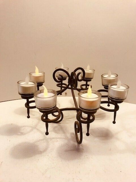 An Attractive Wrought Iron Table Centrepiece With Candleholders