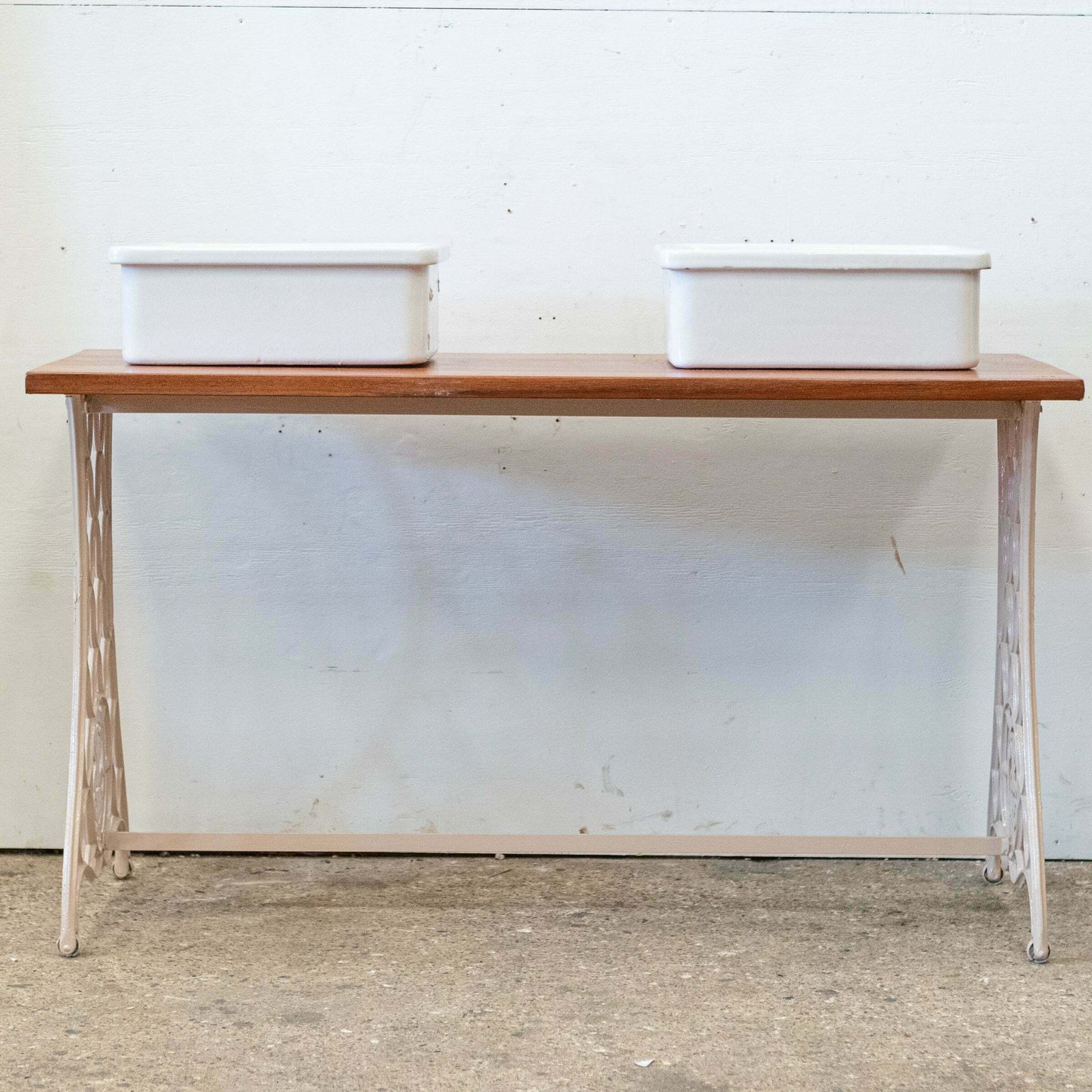 Twin Countertop Butler Sinks On Reclaimed Cast Iron And Teak Unit photo 850.0