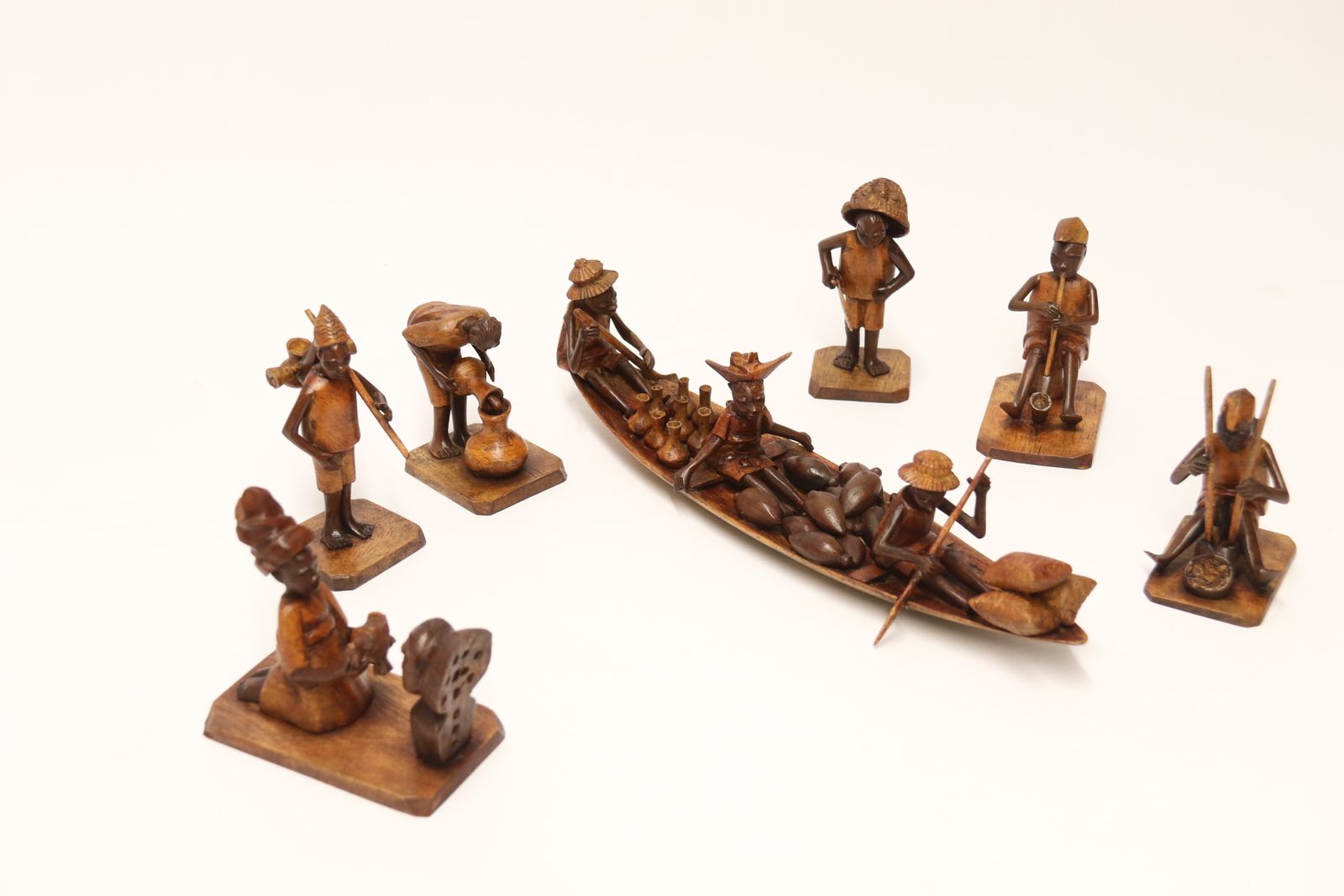 photo vintage A Group Of 7 Nigerian Hardwood Carved Figures, C 1920