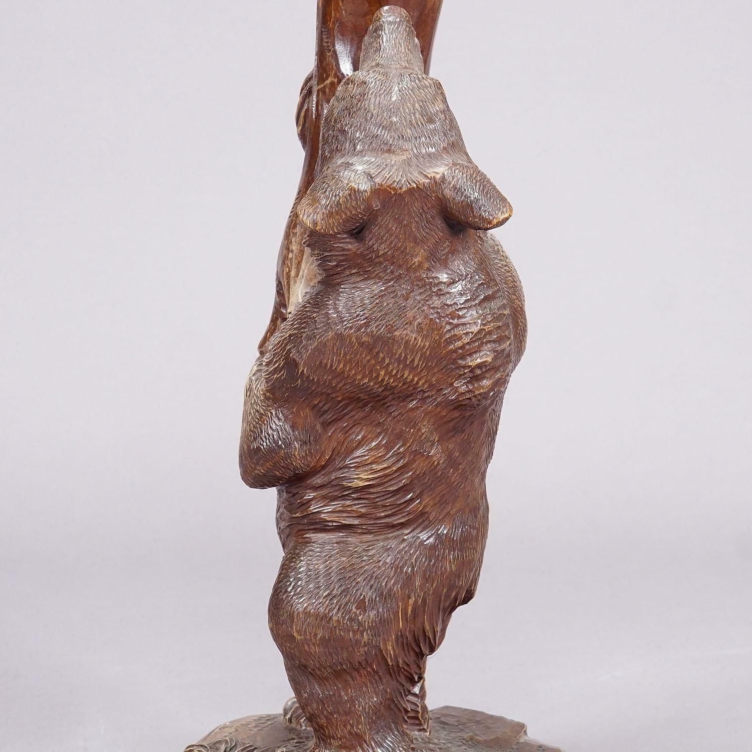 A Wooden Carved Black Forest Bear With Glass Vase Ca. 1900s photo furniture
