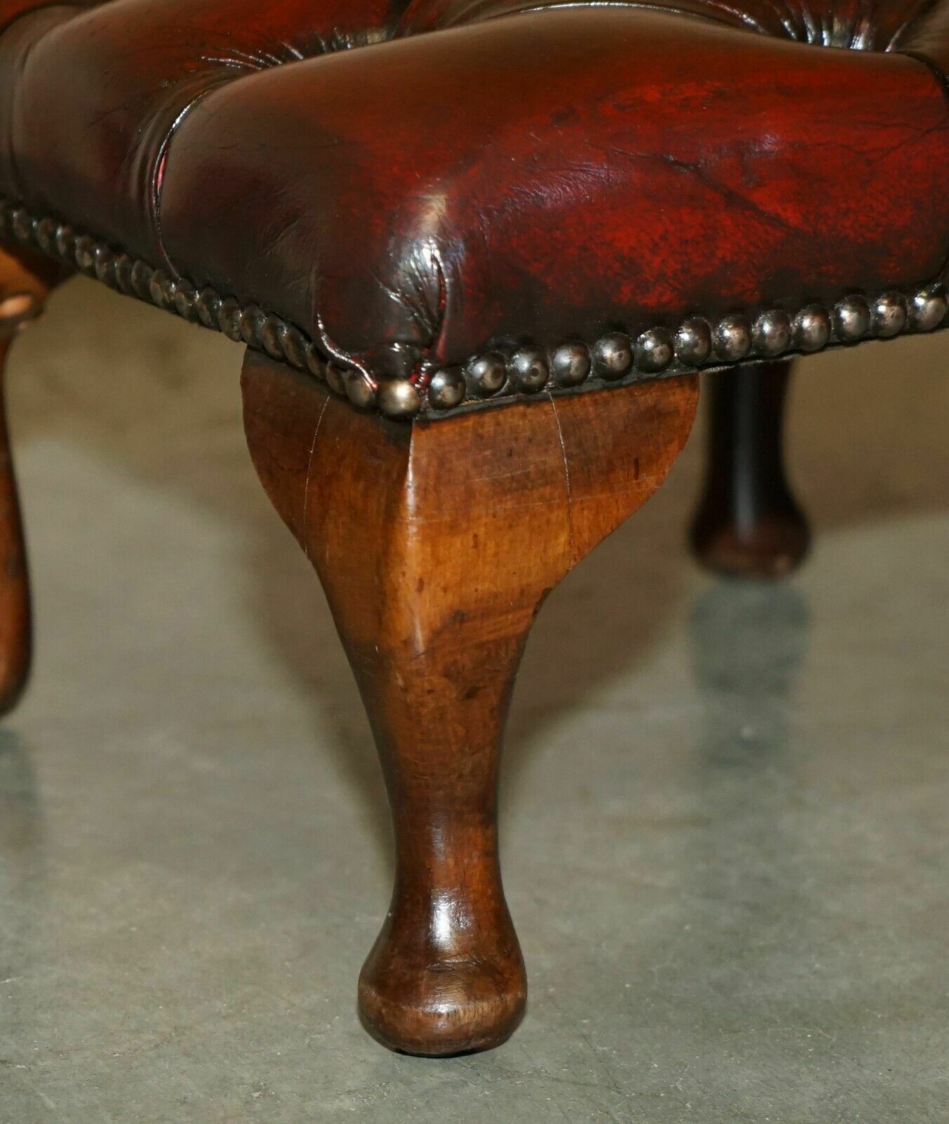 photo buy Pair Of Vintage Chesterfield Tufted Wingback Armchair Oxblood Leather Footstools