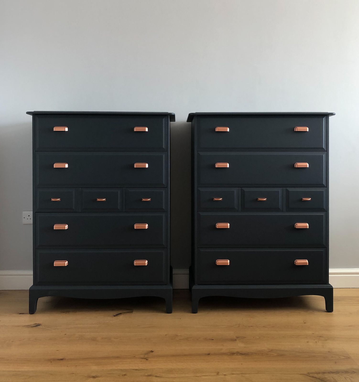 A Pair Of Stag Minstrel Tallboy Chest Of Drawers Painted Blue With Copper Handles photo furniture