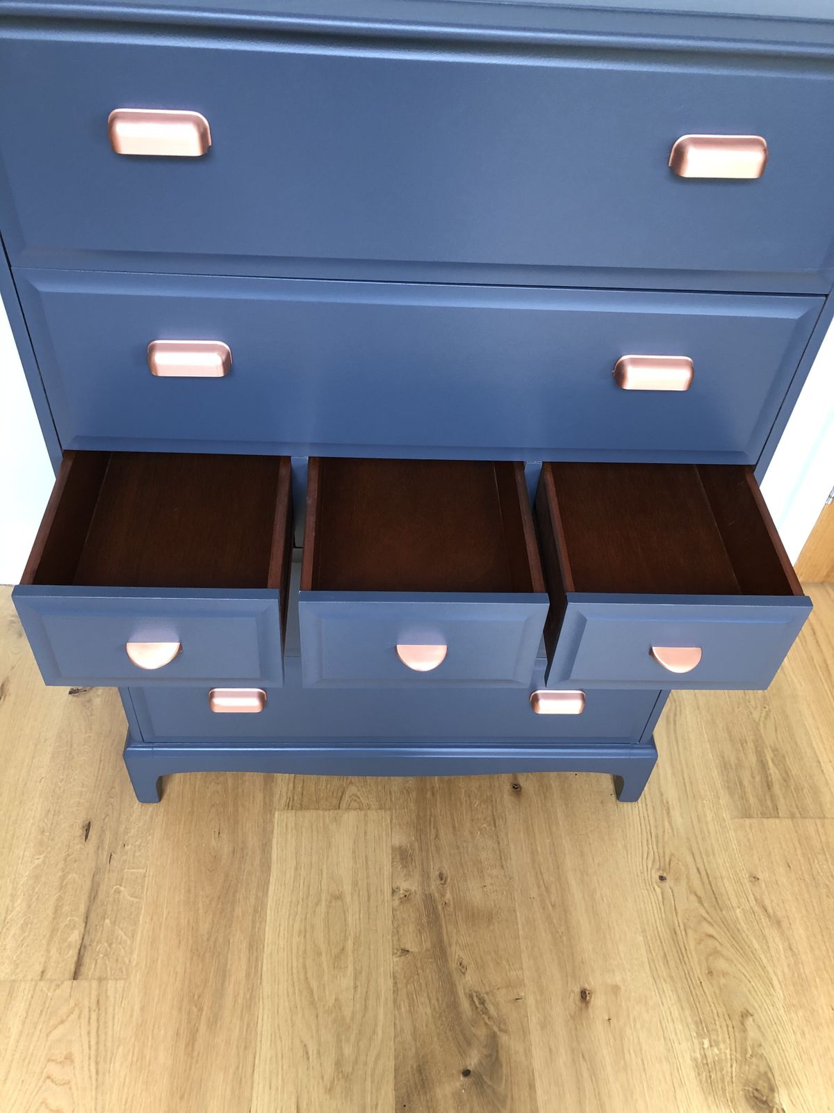 A Pair Of Stag Minstrel Tallboy Chest Of Drawers Painted Blue With Copper Handles photo for sale