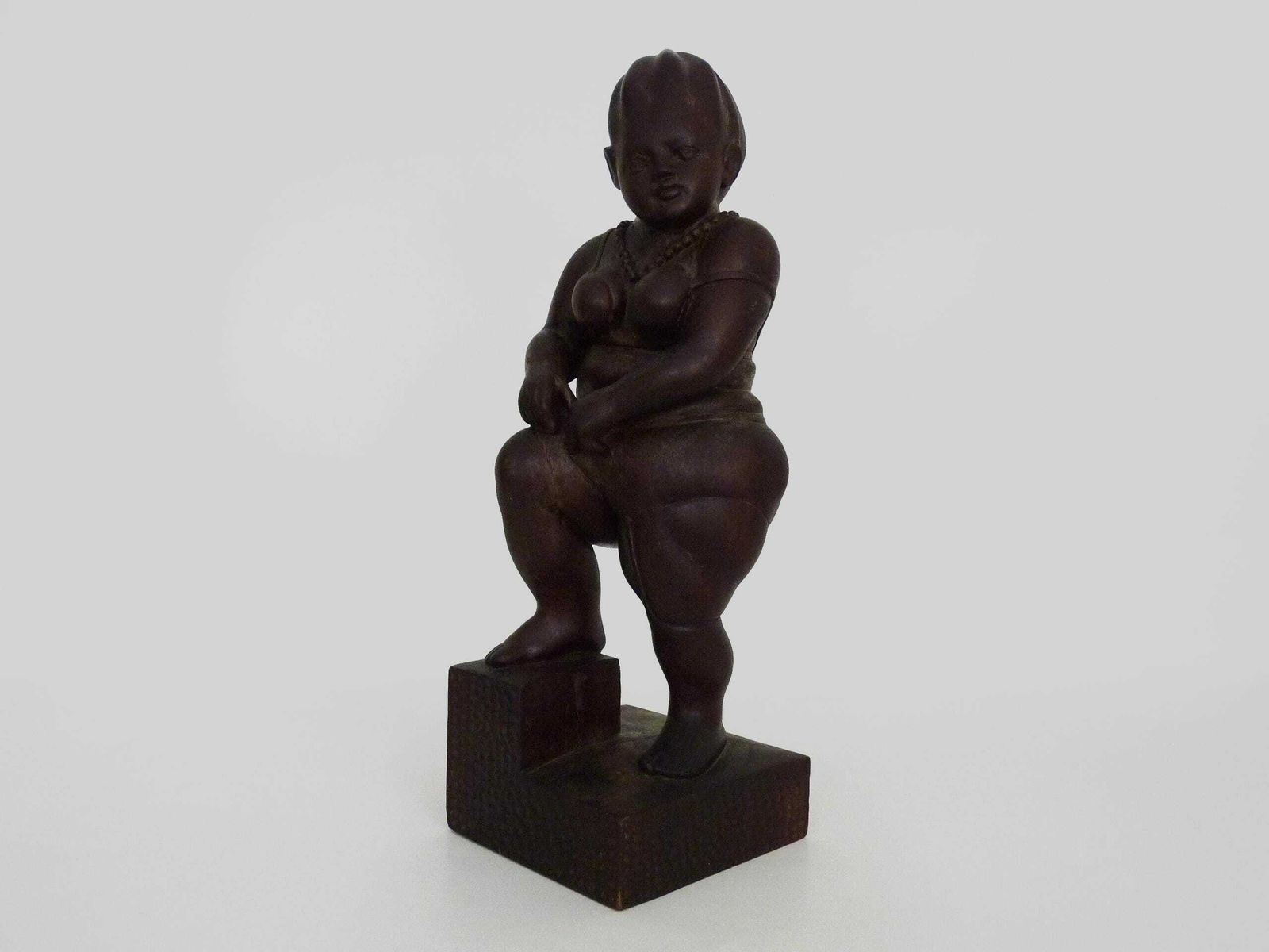Grotesque Exotic Wood Sculpture Of A Woman Showing Her Thigh. 80s. Botero Style