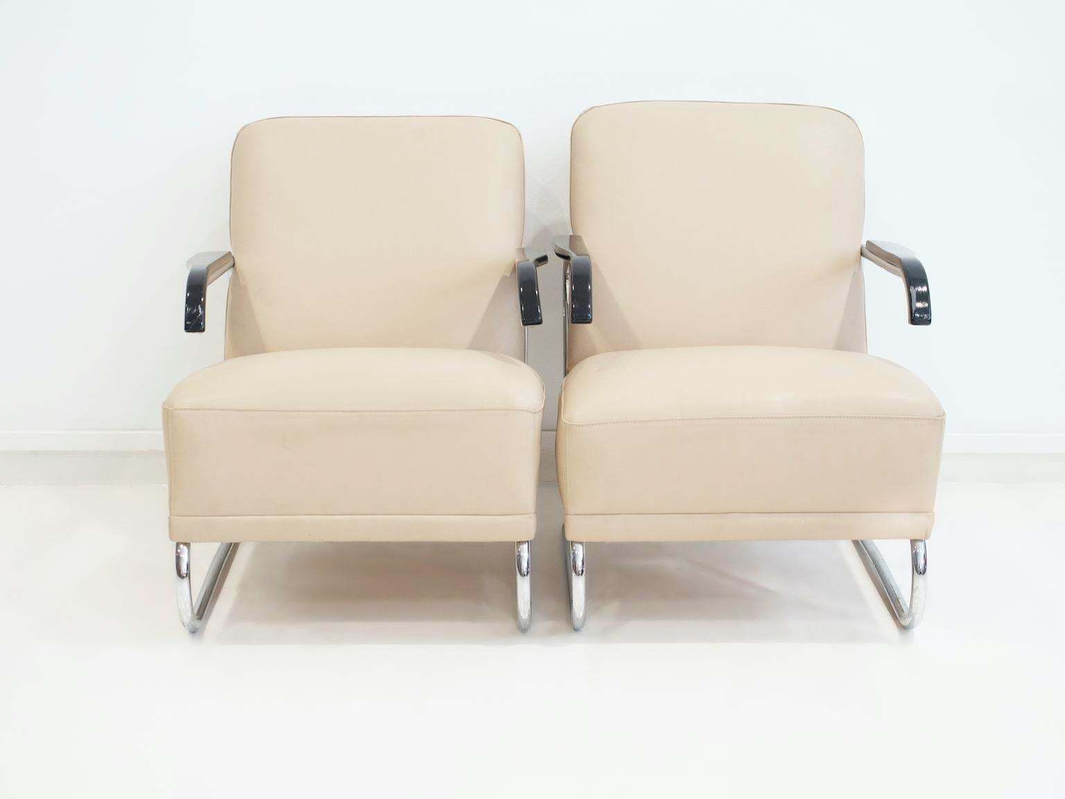 Pair Of Beige Leather And Tubular Steel Lounge Chairs photo furniture