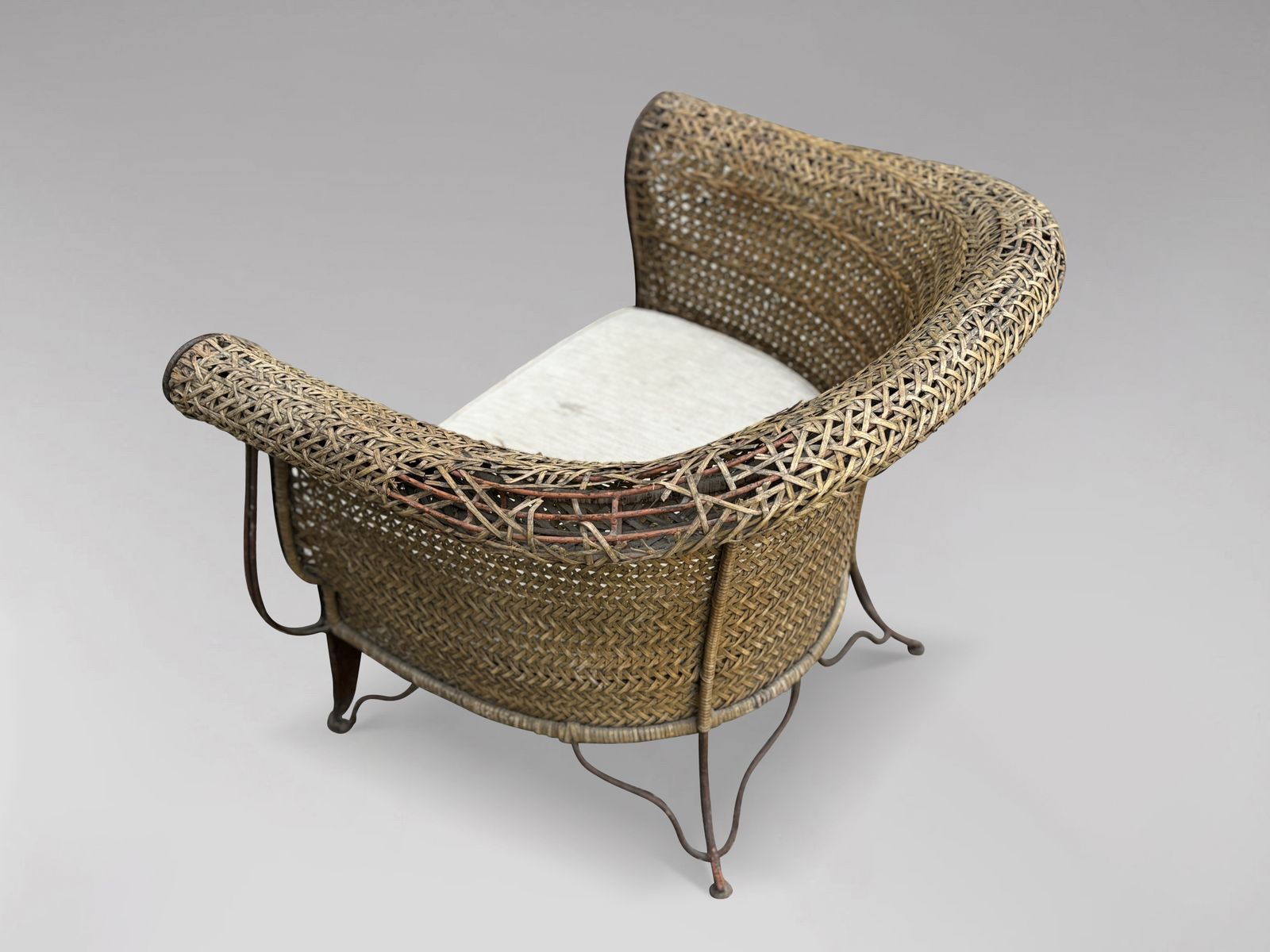 photo for sale Pair Of 1970s Woven Rattan Lounge Armchairs
