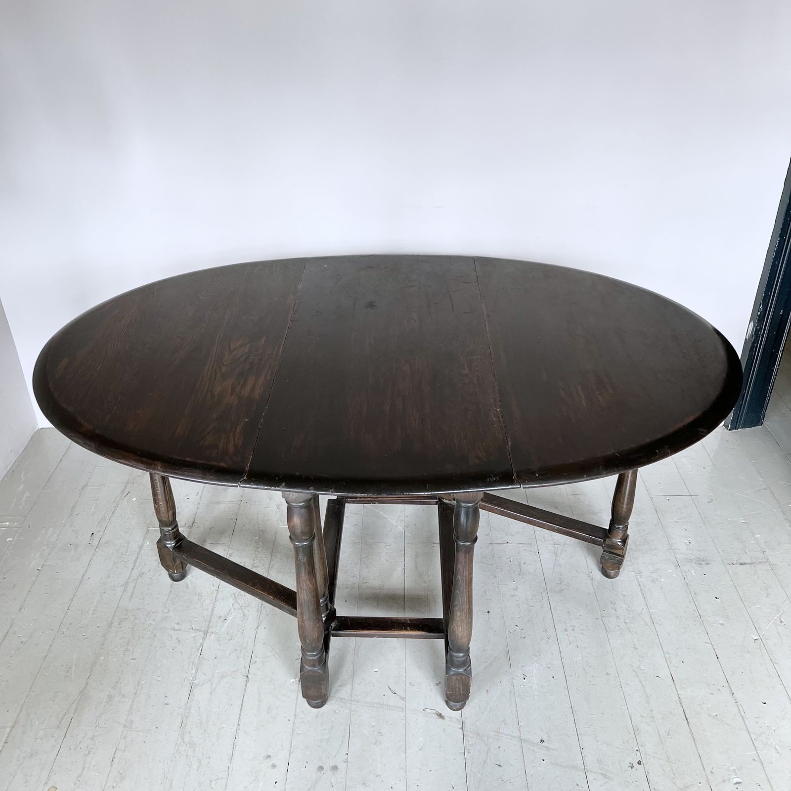 Dark Stained Solid Wood Oval Drop Leaf Table photo for sale