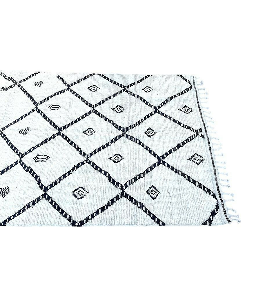 A Vintage Handwoven Moroccan Berber Rug With Tribal Diamond And Line Pattern photo vinterior
