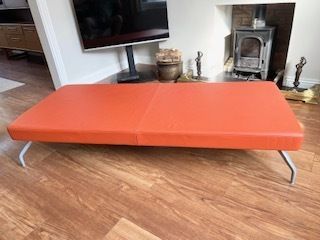 Mid Century Danish Style Long Bench. Orange Vinyl Upholstery And Stainless Steel Legs. Orangebox. photo buy