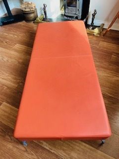 Furniture Mid Century Danish Style Long Bench. Orange Vinyl Upholstery And Stainless Steel Legs. Orangebox. photo