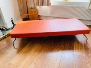 250.0 Mid Century Danish Style Long Bench. Orange Vinyl Upholstery And Stainless Steel Legs. Orangebox. photo