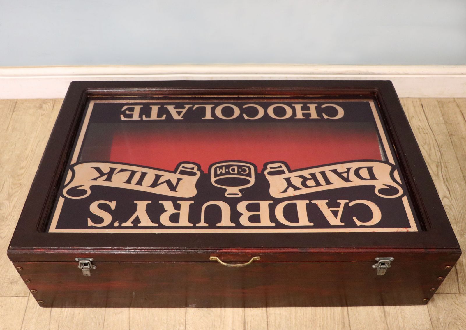 A Superb Wedge Shaped Countertop Display Cabinet, Later Hand Sign Written For Cadburys Dairy Milk Chocolate. photo 395.0