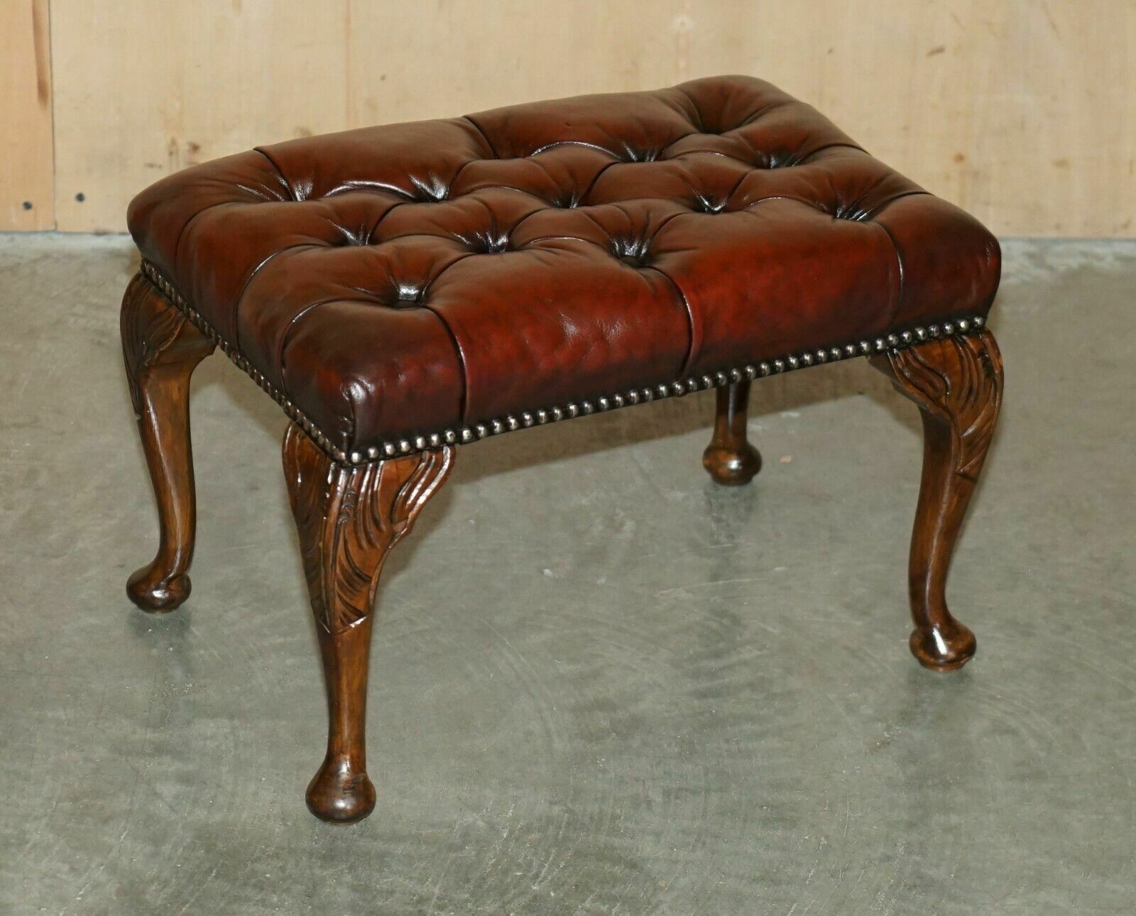 12000.0 Pair Of Chesterfield Vintage Oxblood Leather Wingback Armchairs & Footstools photo