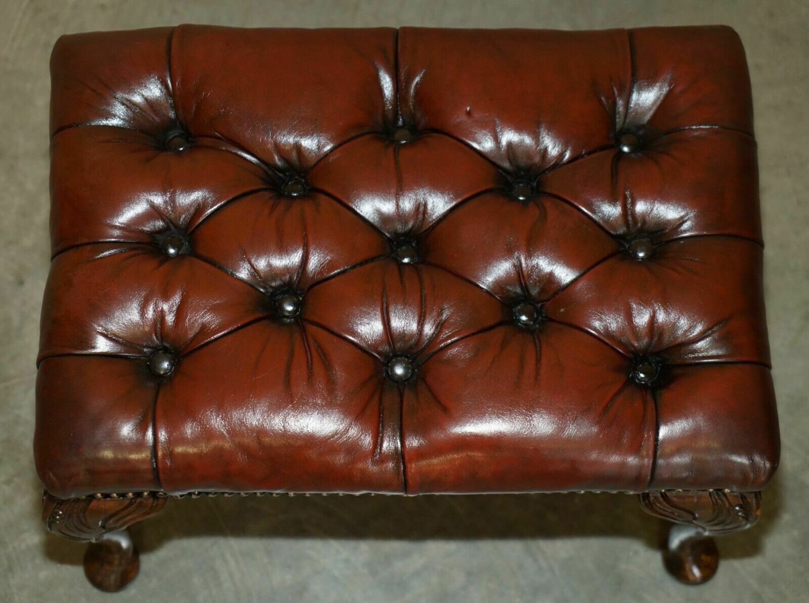 photo buy Pair Of Chesterfield Vintage Oxblood Leather Wingback Armchairs & Footstools
