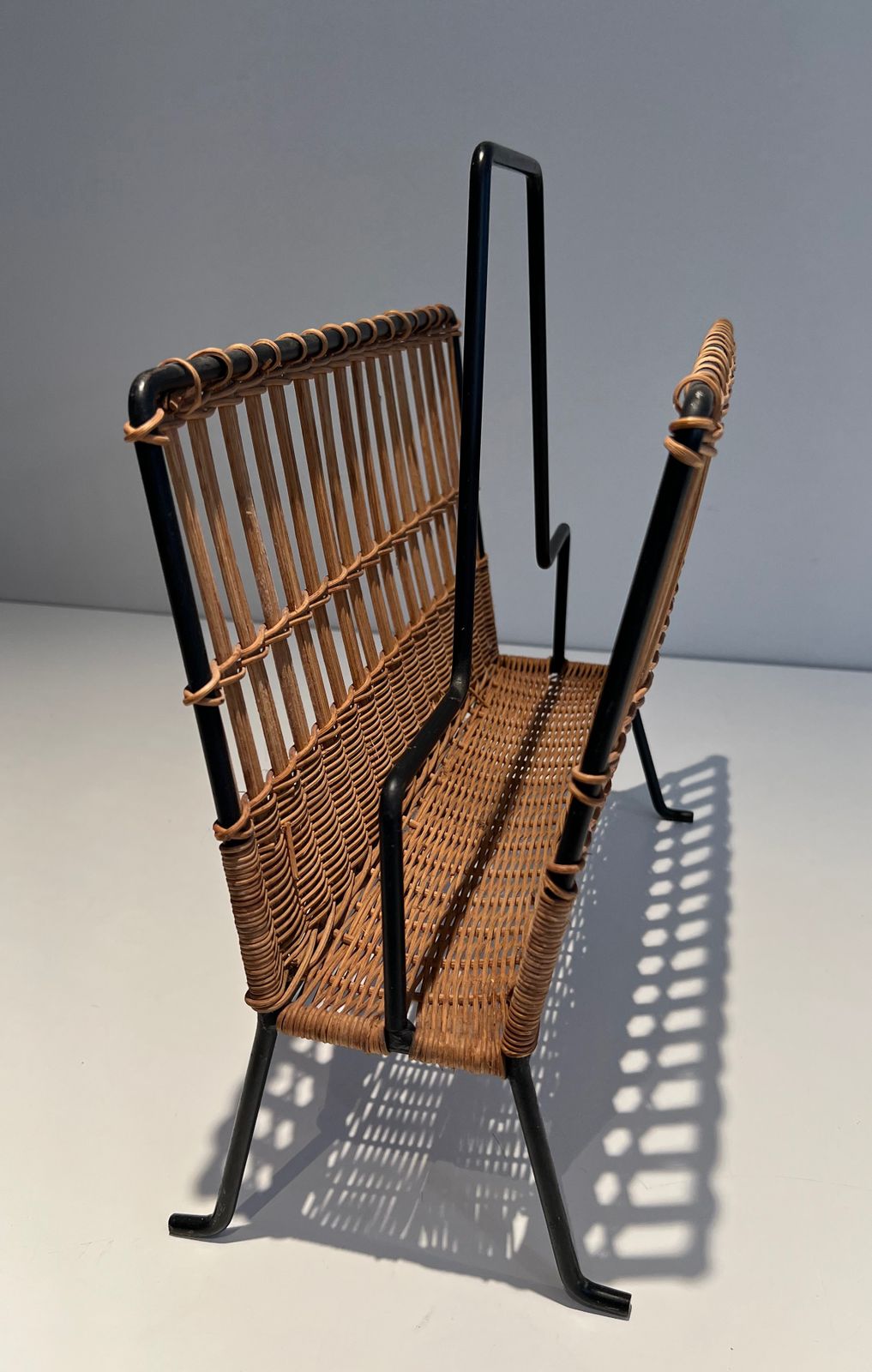 Black Lacquered Metal And Rattan Magazine Rack photo 650.0