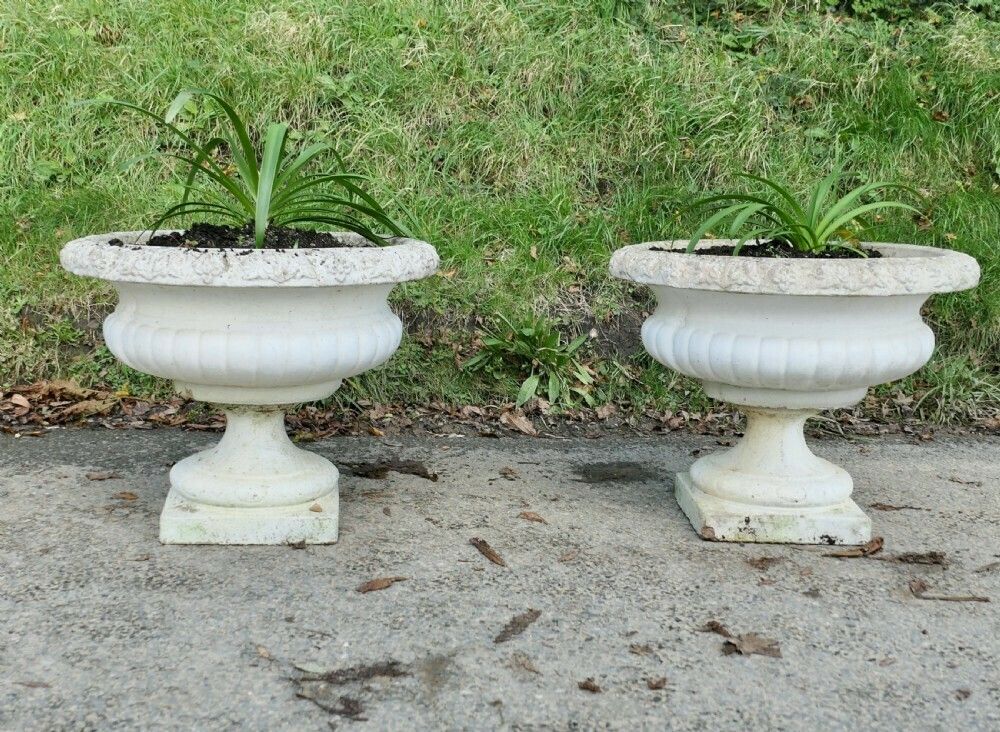 A Pair Of Large Weathered Cast Stone Garden Planters