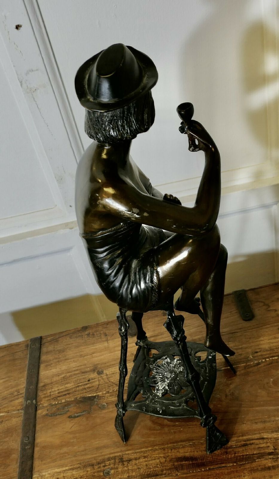 Bronze Statue Of A Girl On A Stool Drinking Champaign photo vintage
