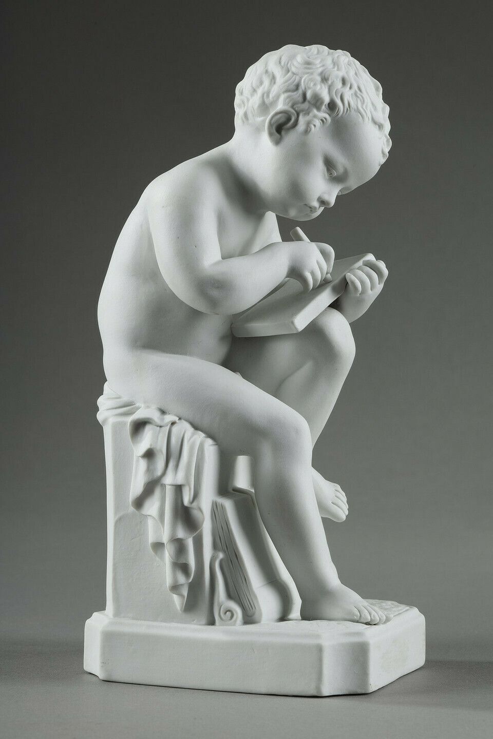 Two Subjects At Biscuit Representing The Child Reading And The Child Drawing. photo 1375.0