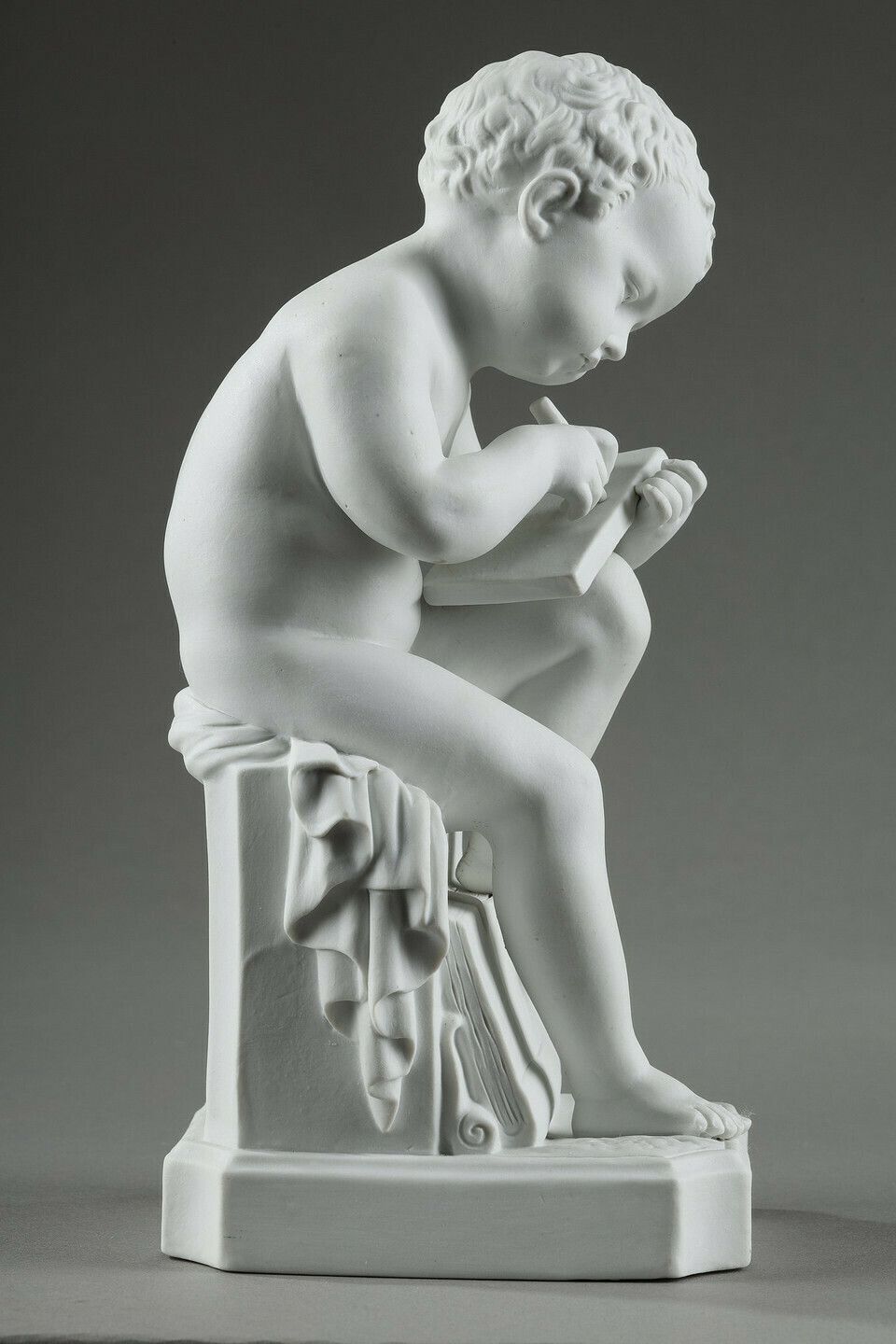 photo furniture Two Subjects At Biscuit Representing The Child Reading And The Child Drawing.