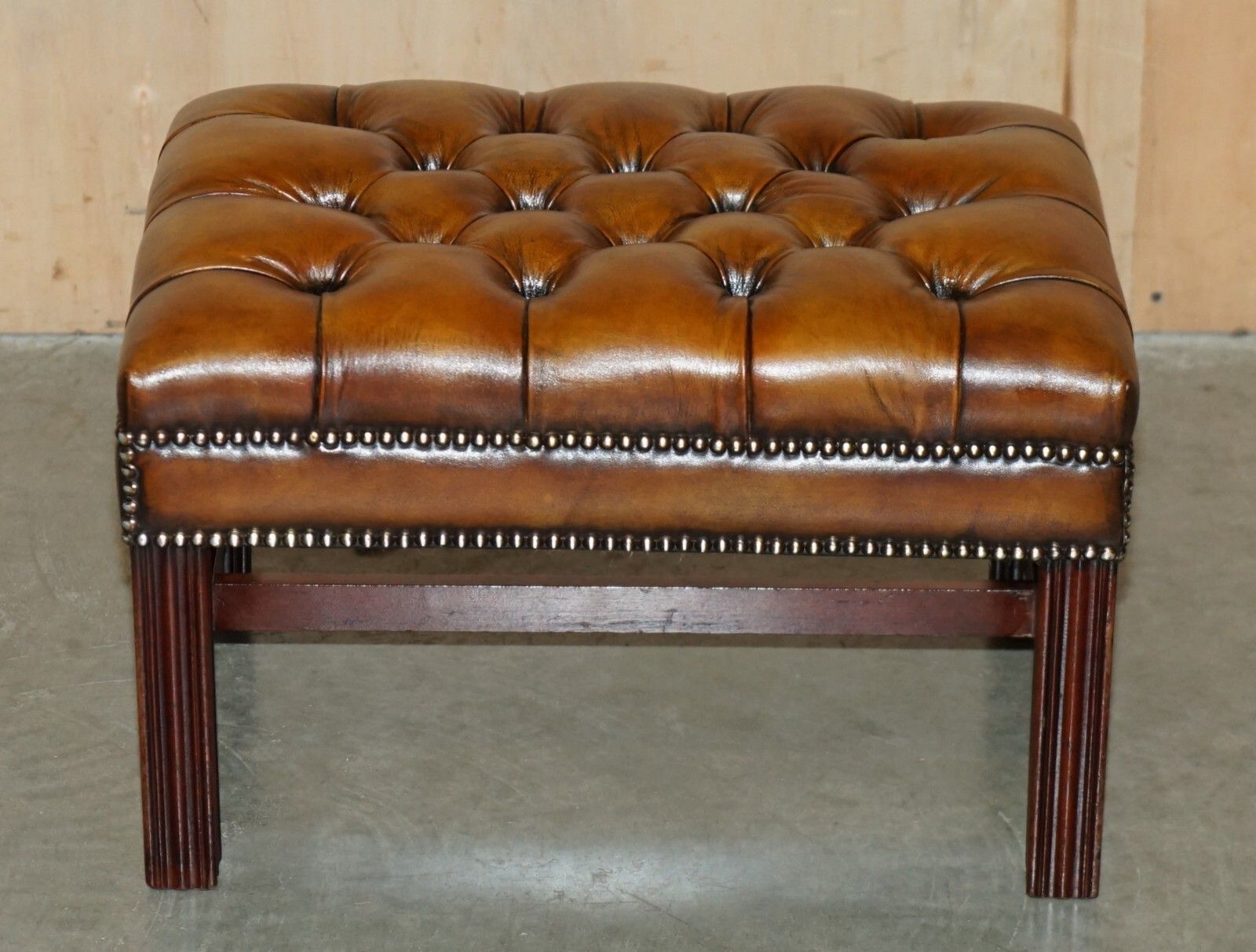 photo buy Pair Of Fully Restored Vintage Hand Dyed Brown Leather Chesterfield Footstools