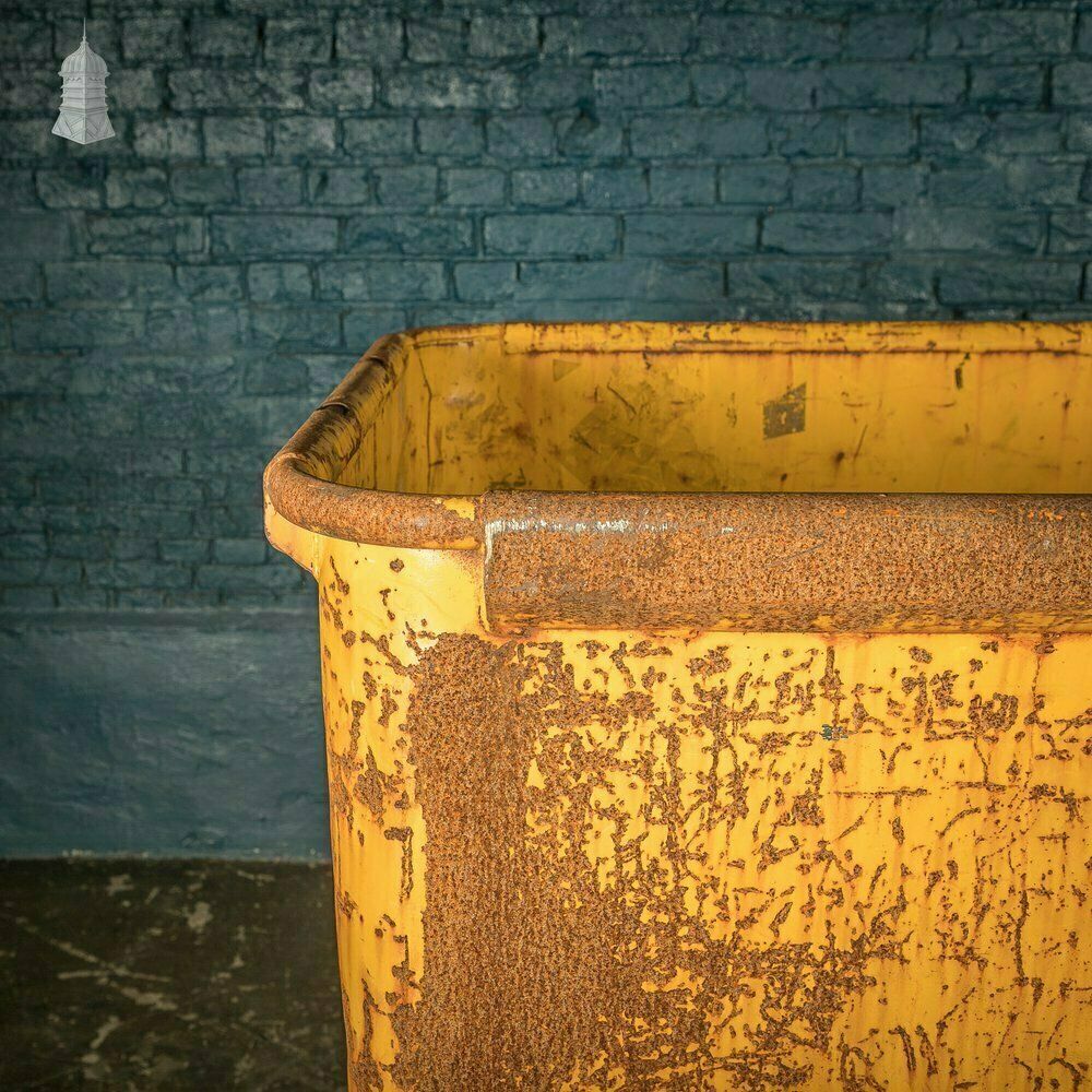 photo vintage Wheeled Industrial Cart, Rusty Distressed Yellow Painted Steel, Factory Skip