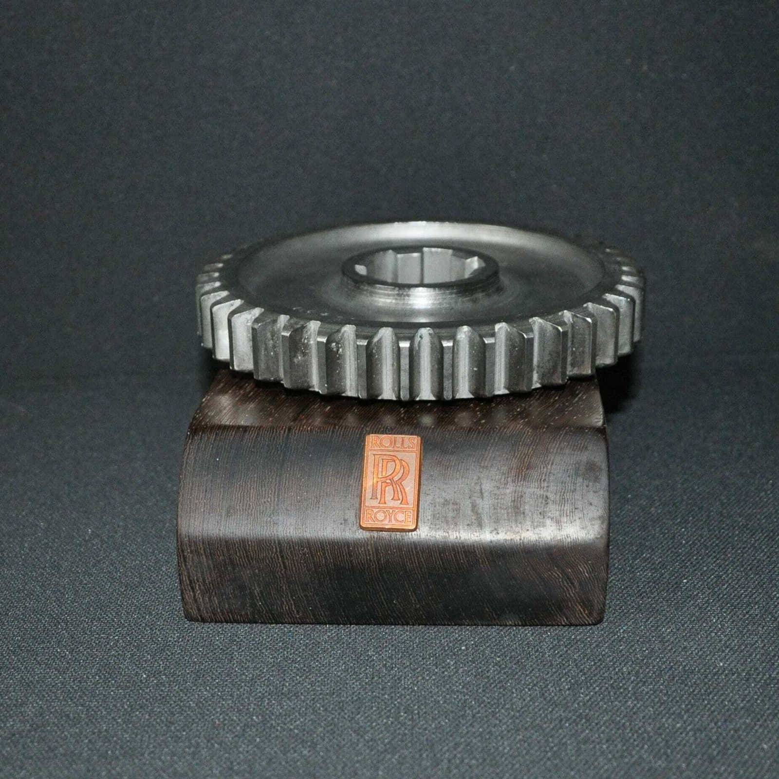 Rolls Royce Car Engine Gear On Hard Wood Base