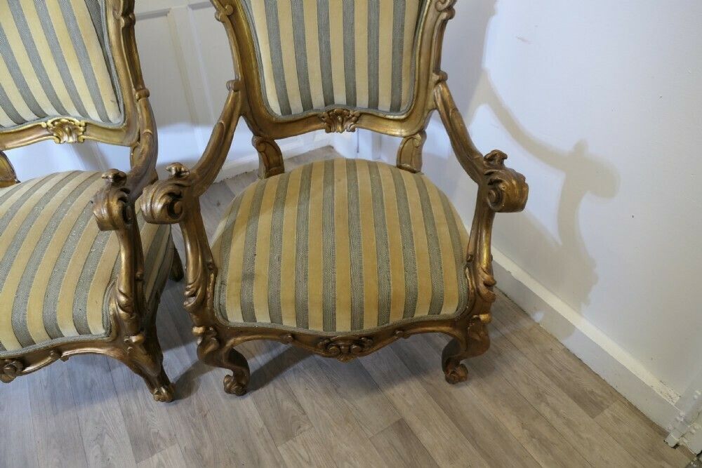 photo furniture A Pair Of Large Italian Carved Giltwood Arm Chairs