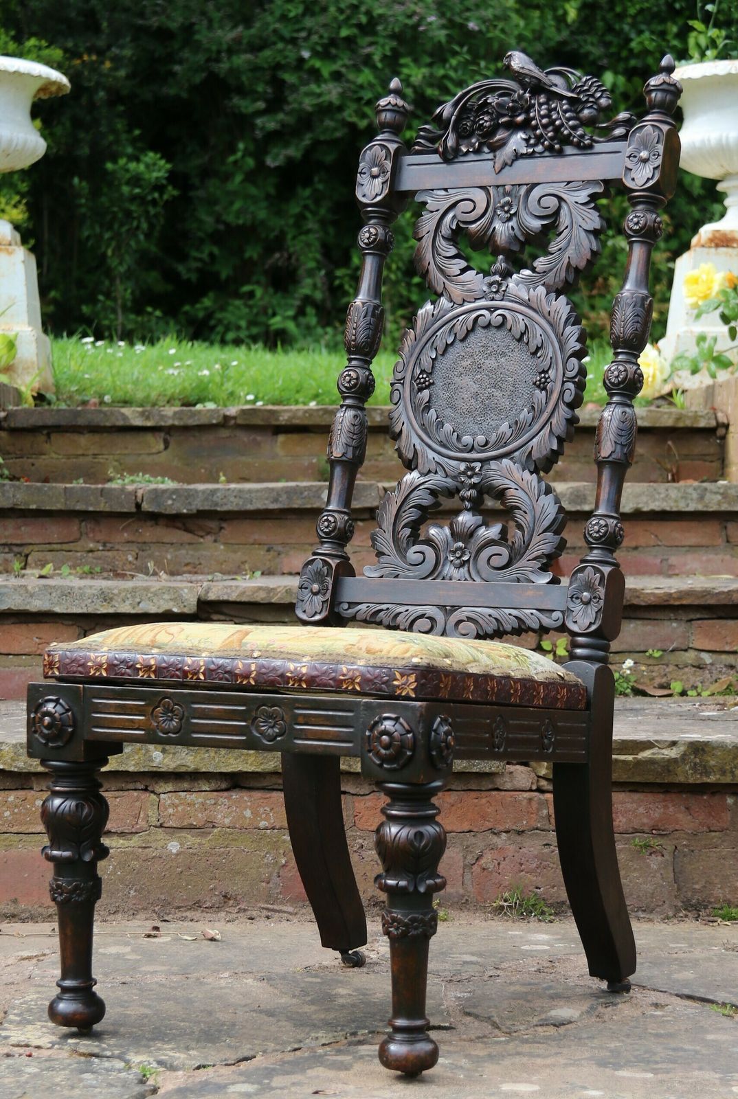 A 19th Century English Country House Carved Walnut High Backed Chair With A Tapestry Seat