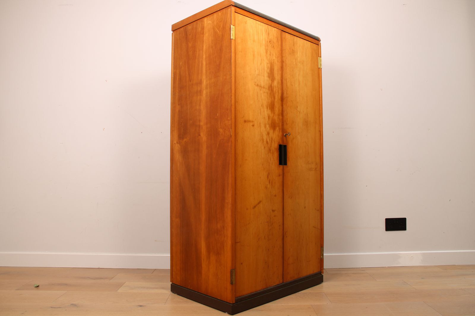 A Vintage Mid Century Cupboard, With Faux Leather Top And Recessed Metal Handles photo for sale