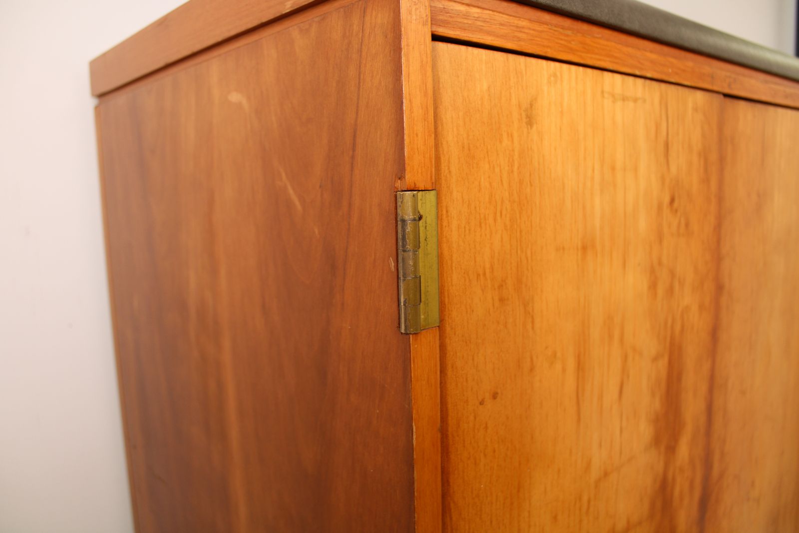 Furniture A Vintage Mid Century Cupboard, With Faux Leather Top And Recessed Metal Handles photo