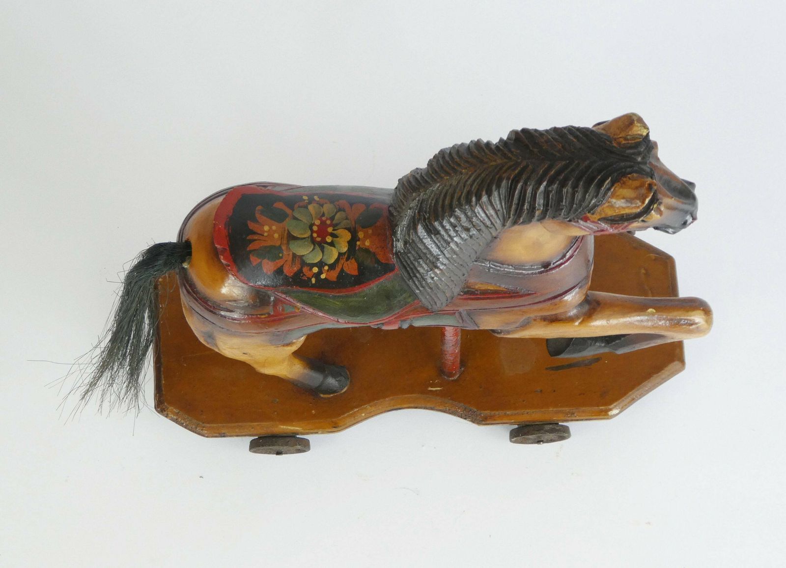 Small Antique Wooden Toy Rocking Horse With Glass Eyes, Old Animal Toy On Wheels With Leather Saddle, Horse Figurine Art Object photo Art