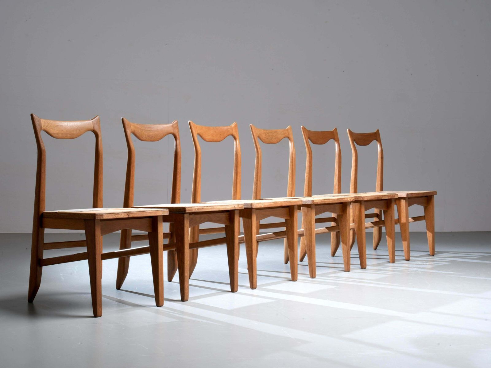 photo for sale Set Of 6 Guillerme Et Chambron Dining Chairs In Oak, France, 1960's