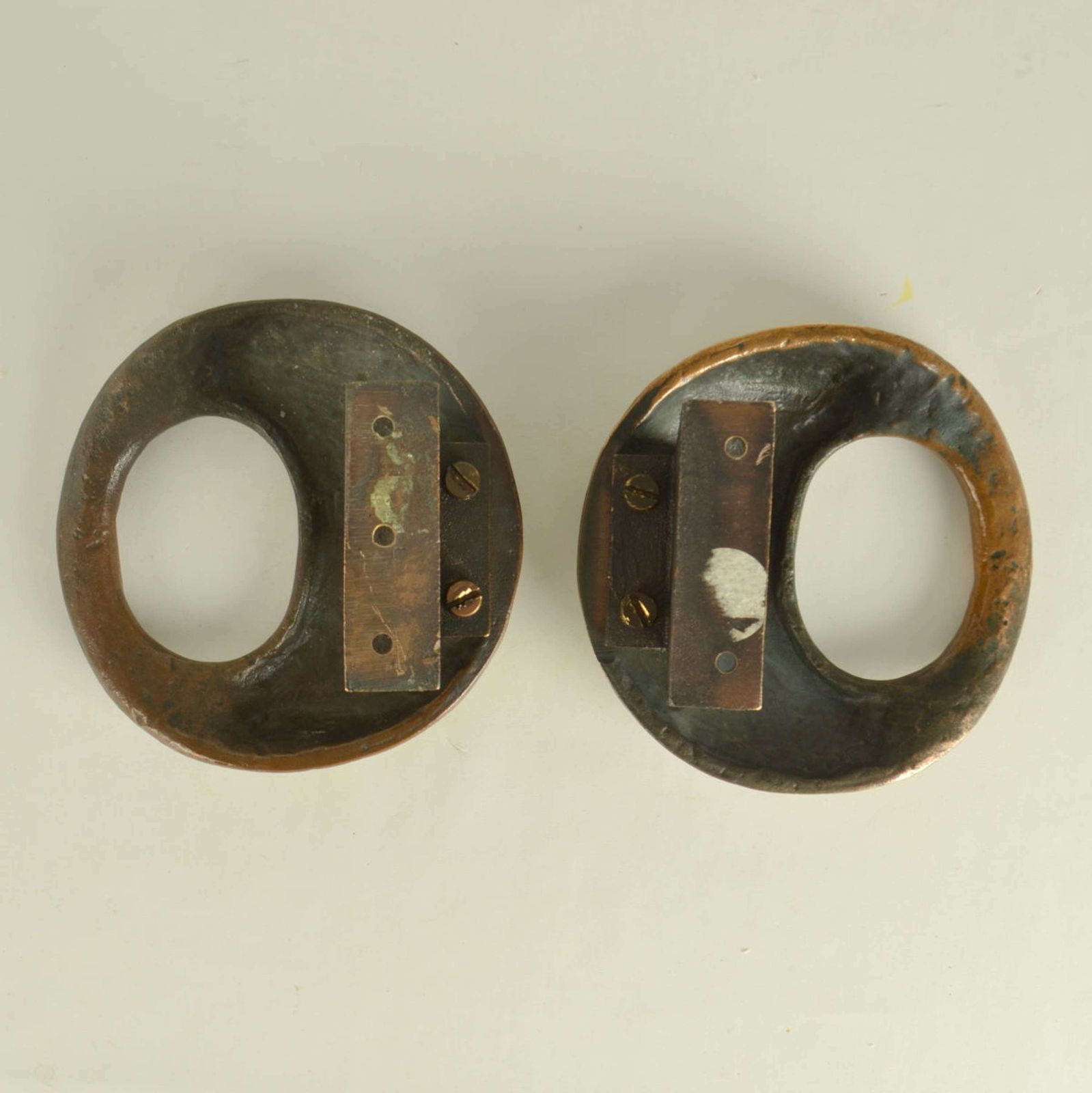 photo furniture Pair Of Round Bronze Relief Door Handles With Oval Grip