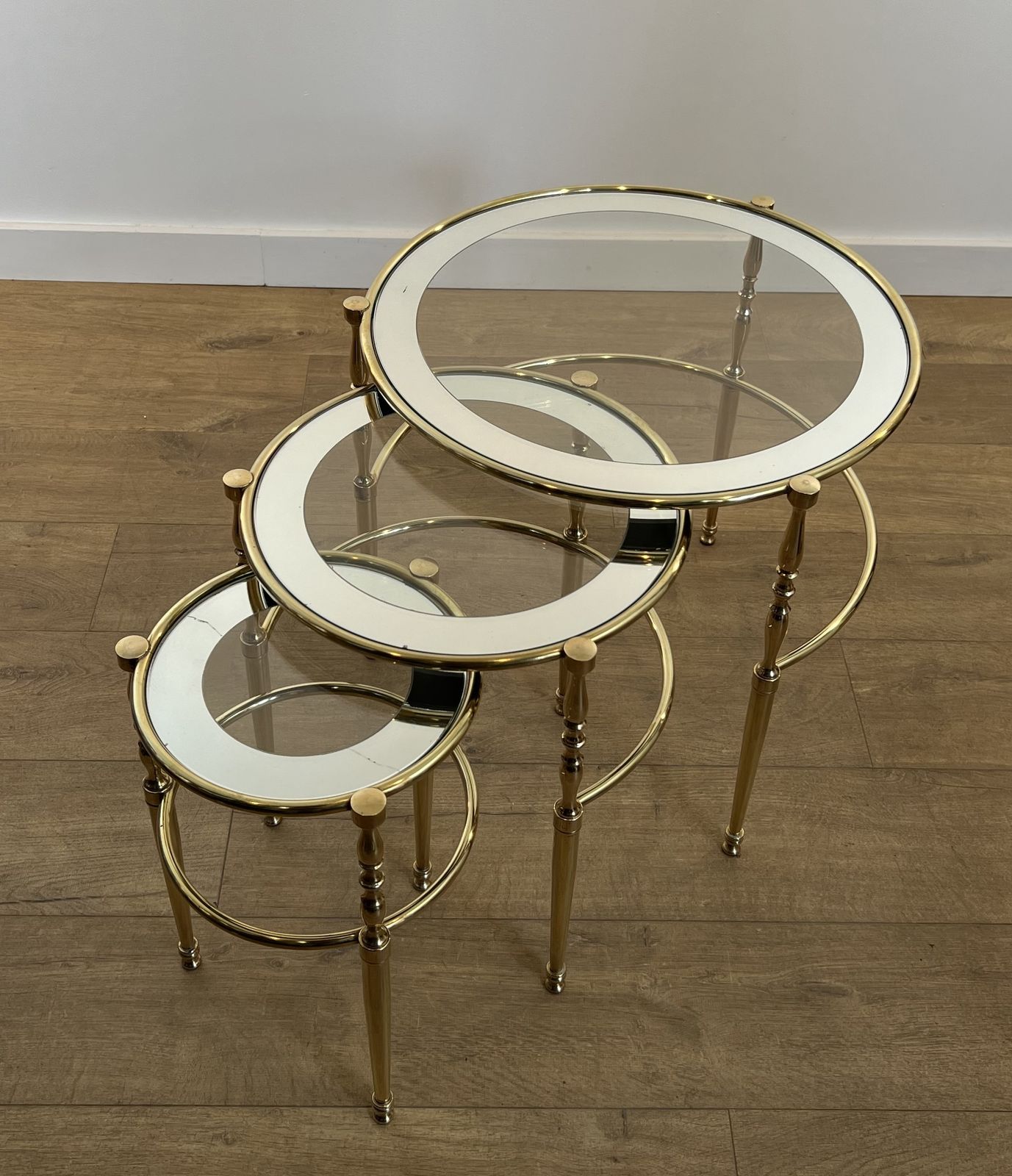 2450.0 Set Of 3 Round Brass Nesting Tables With Glass Tops And Silver Rims photo