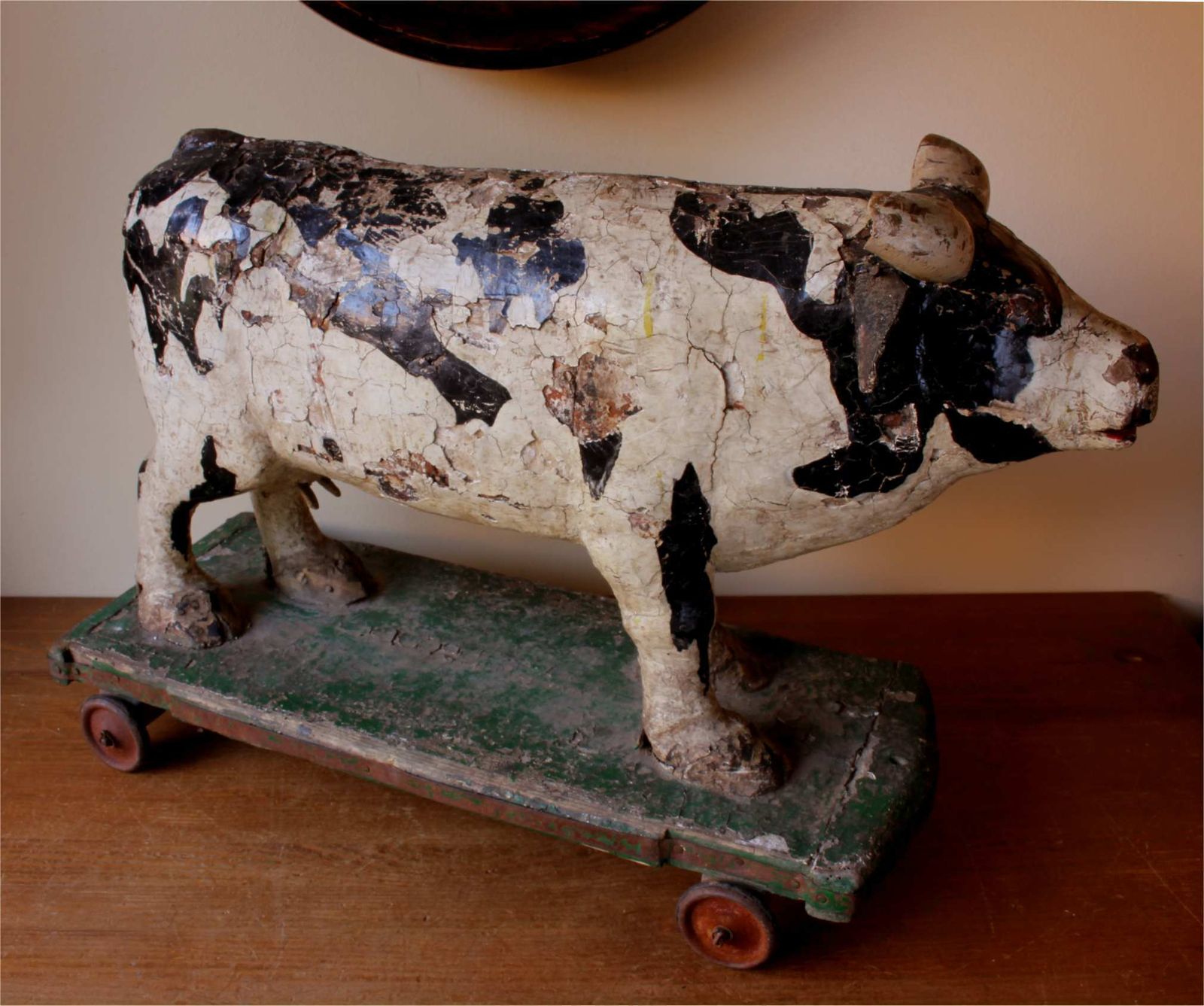 photo vinterior Antique Wooden Folk Art Cow Trolley. Rustic French Butchers Shop Display.