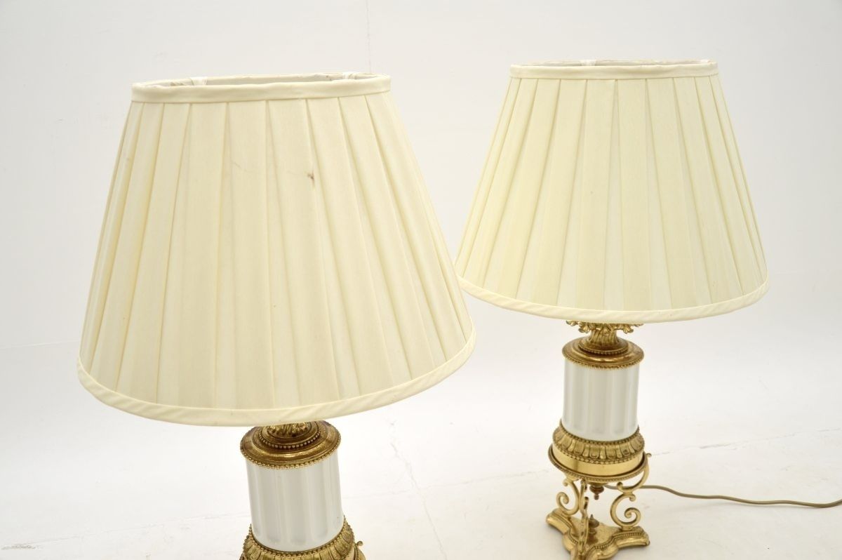 photo for sale Pair Of Antique French Gilt Metal And Ceramic Table Lamps
